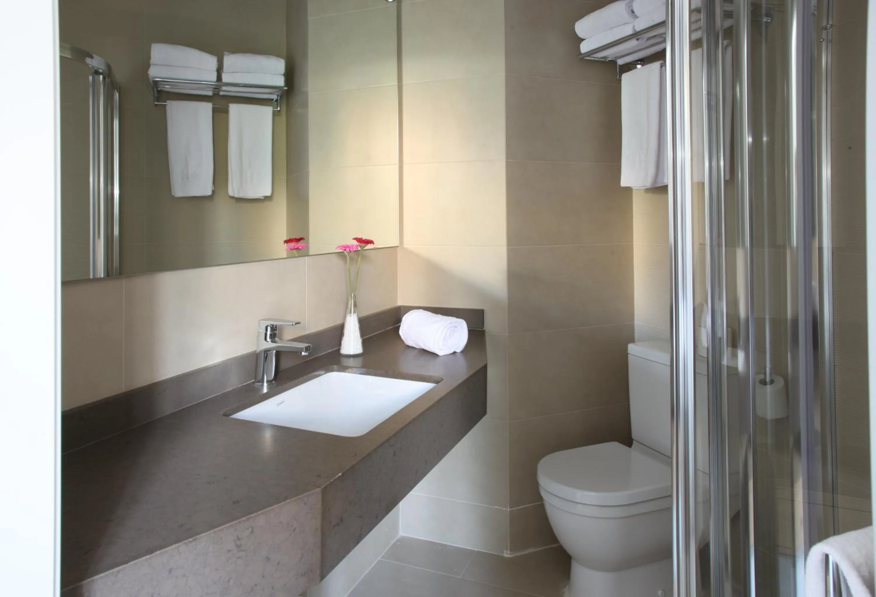 Bathroom in MH Apartments Suites