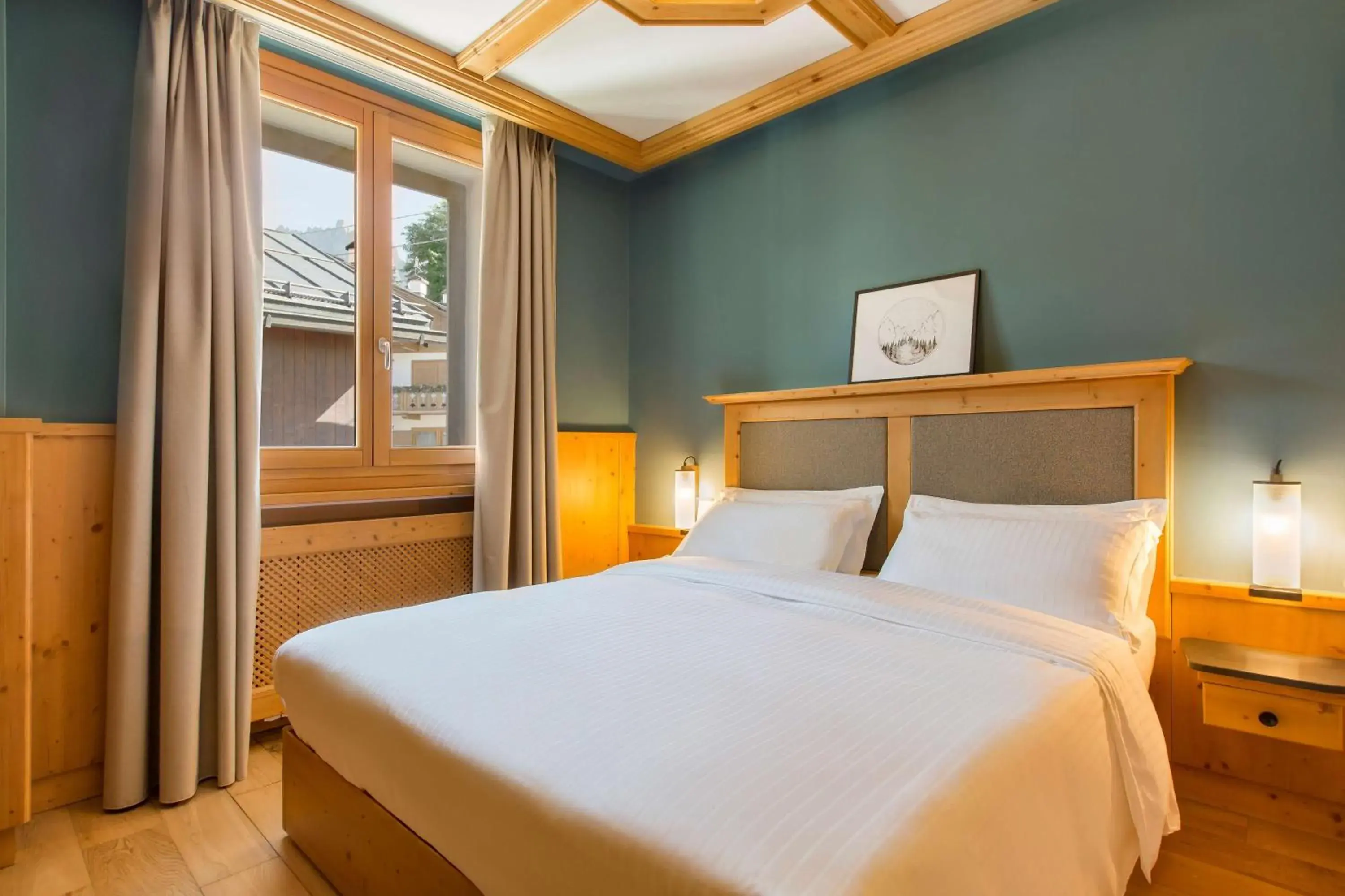 Photo of the whole room, Bed in Radisson Residences Savoia Palace Cortina d’Ampezzo Photo of the whole room, Bed in Radisson Residences Savoia Palace Cortina d’Ampezzo