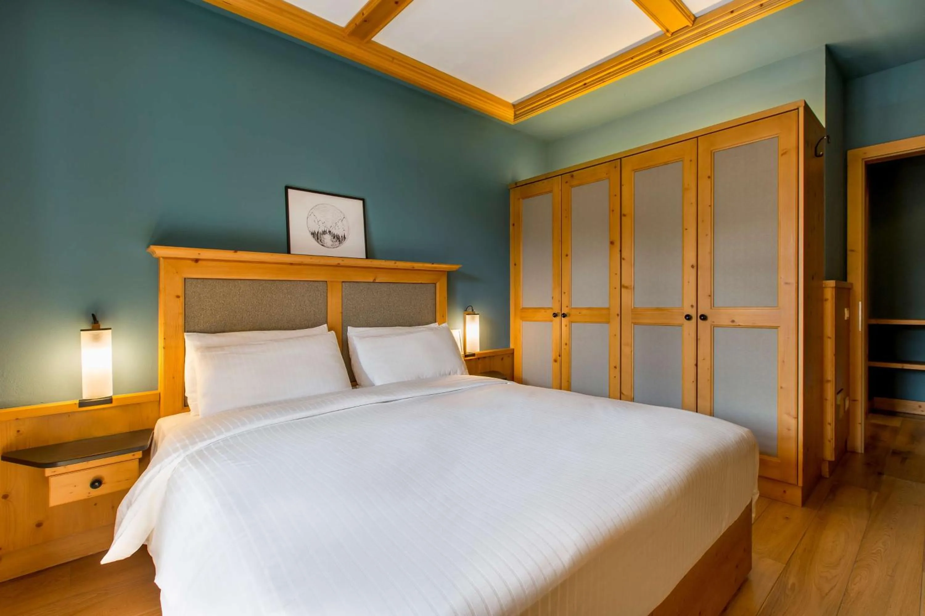 Photo of the whole room, Bed in Radisson Residences Savoia Palace Cortina d’Ampezzo