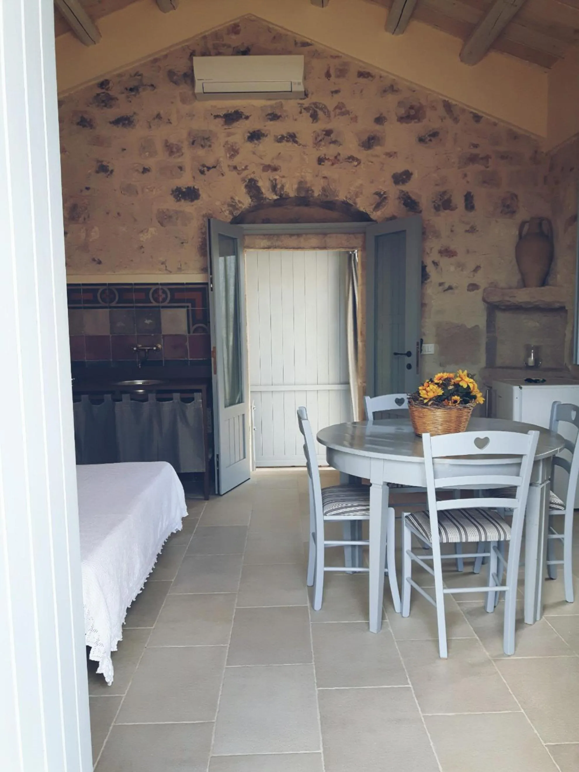 Dining area, Bed in Masseria Cianciò