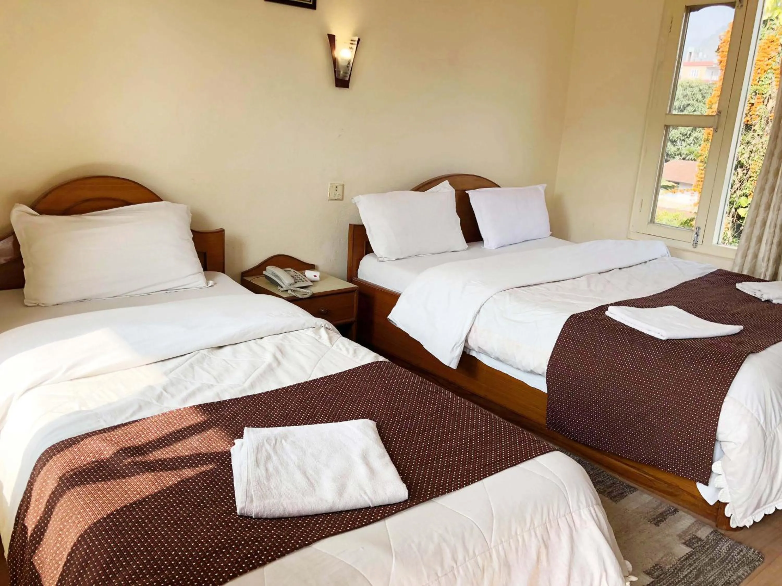 Bed in Hotel Grand Holiday