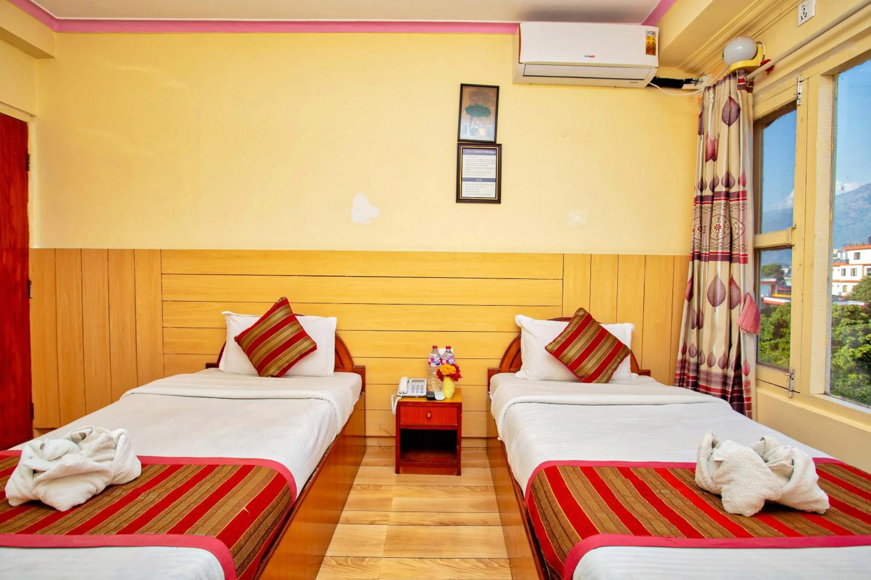 Bed in Hotel Grand Holiday