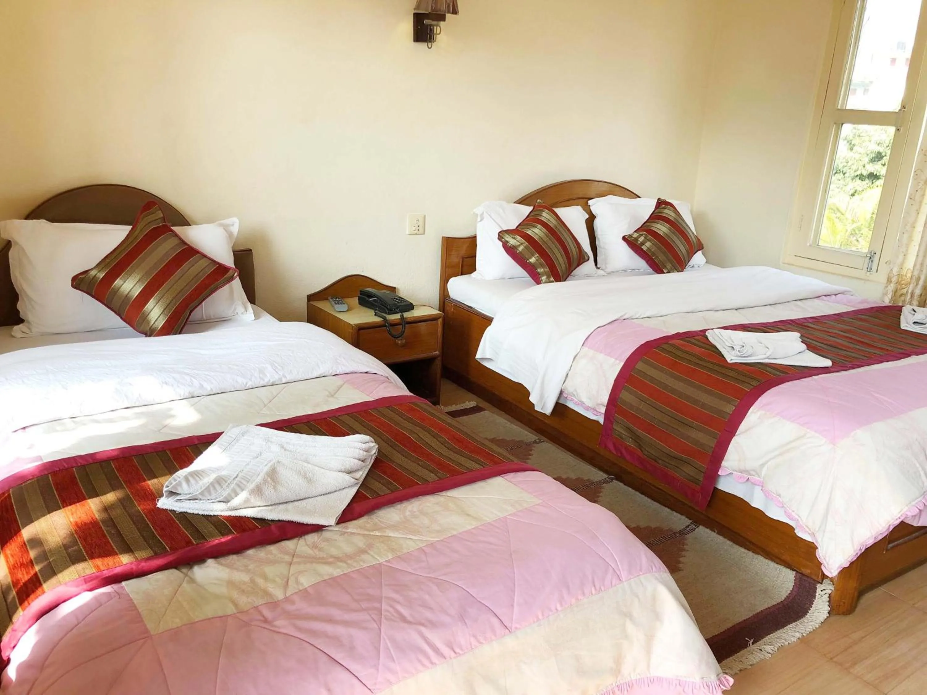 Bed in Hotel Grand Holiday