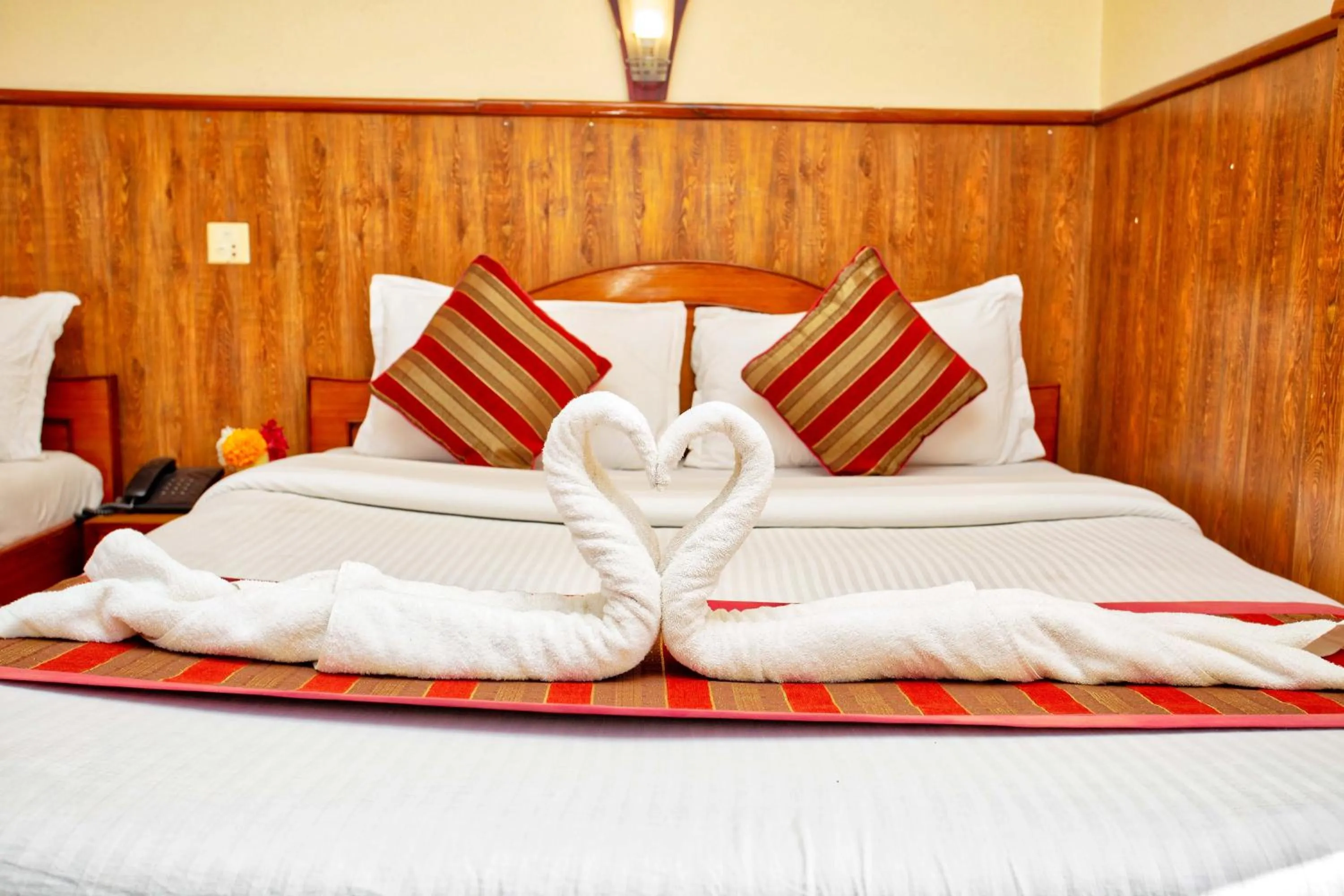 Bed in Hotel Grand Holiday