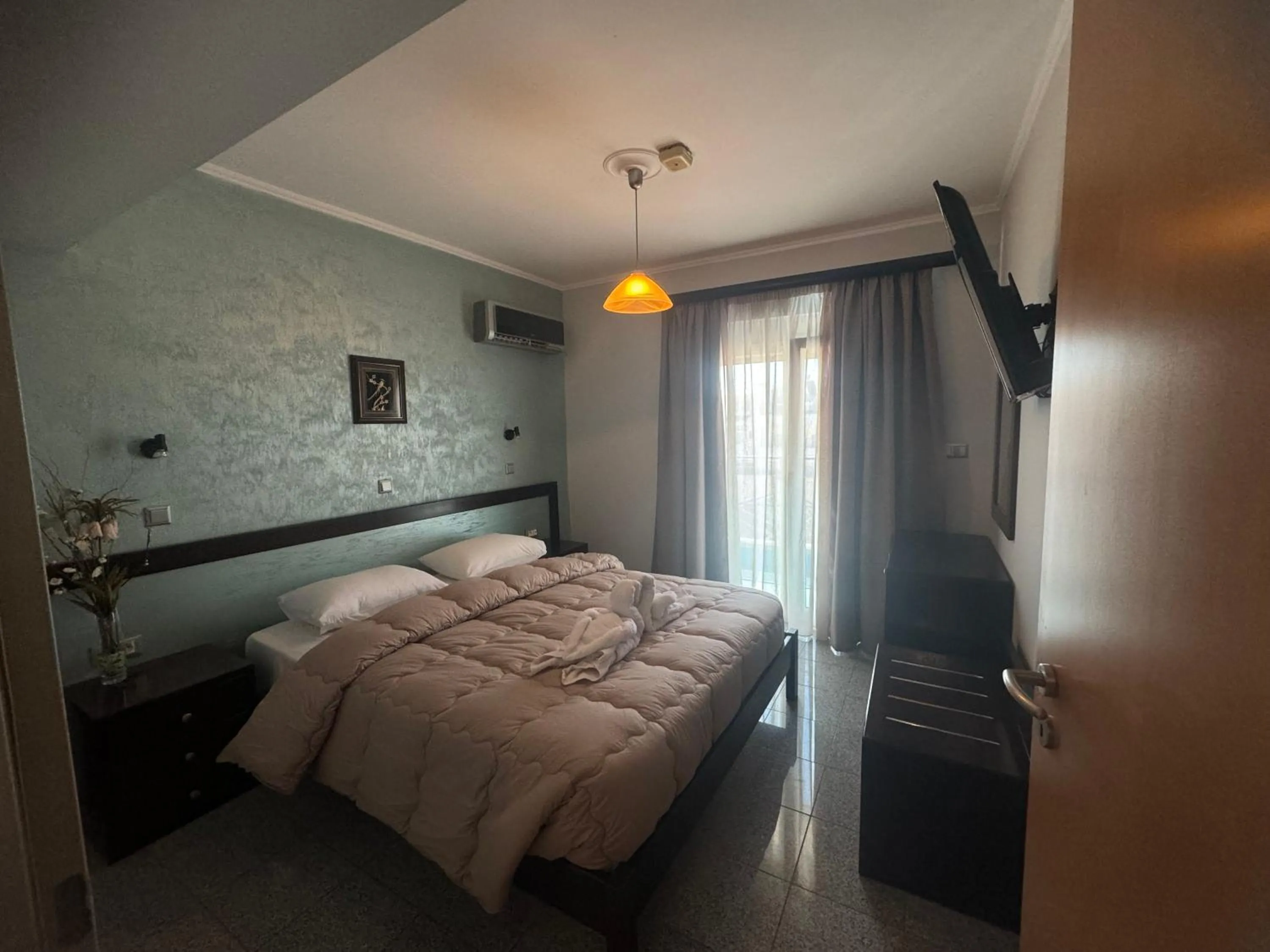 Bed in Comfort Hotel Apartments