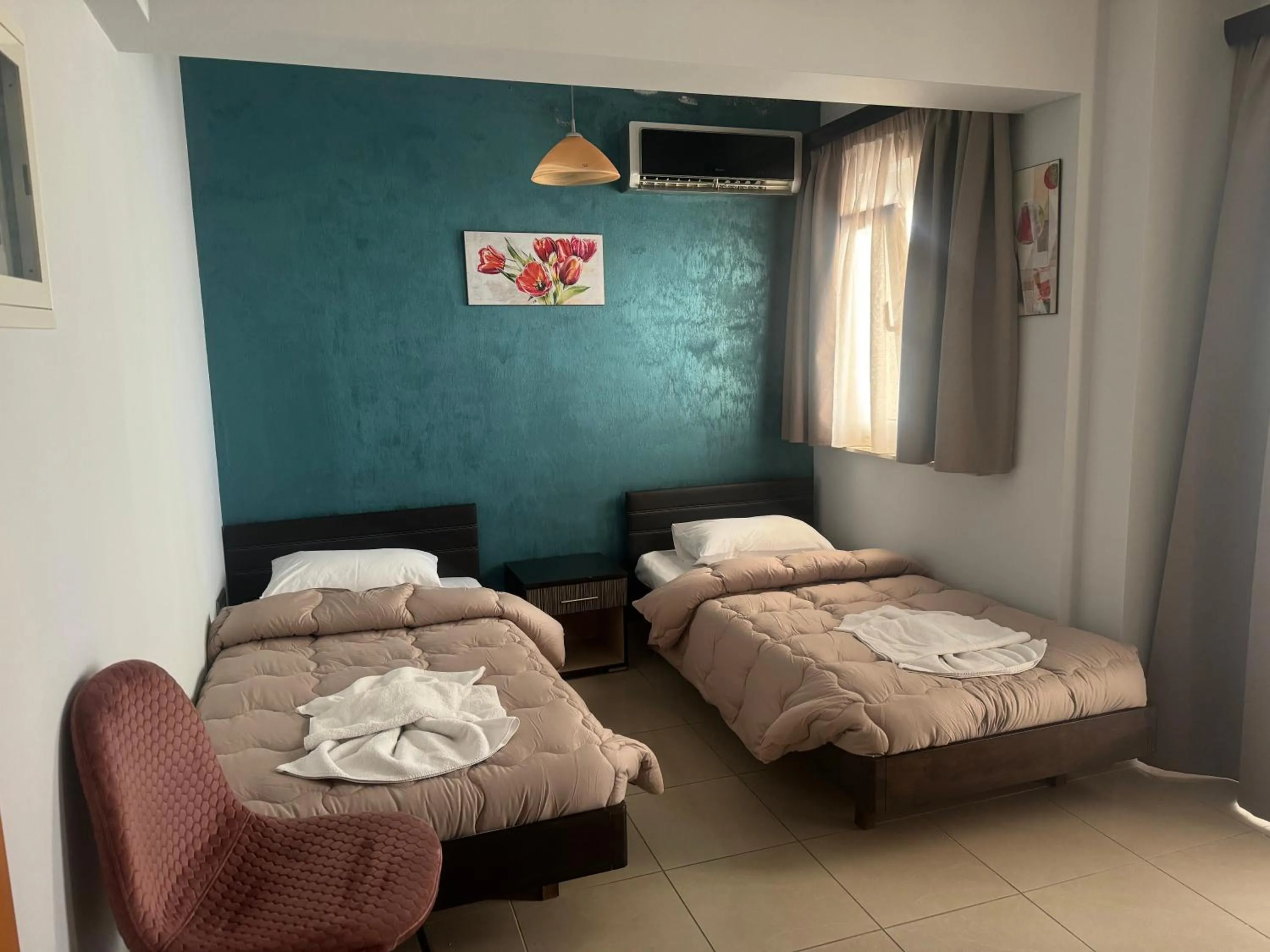 Bed in Comfort Hotel Apartments