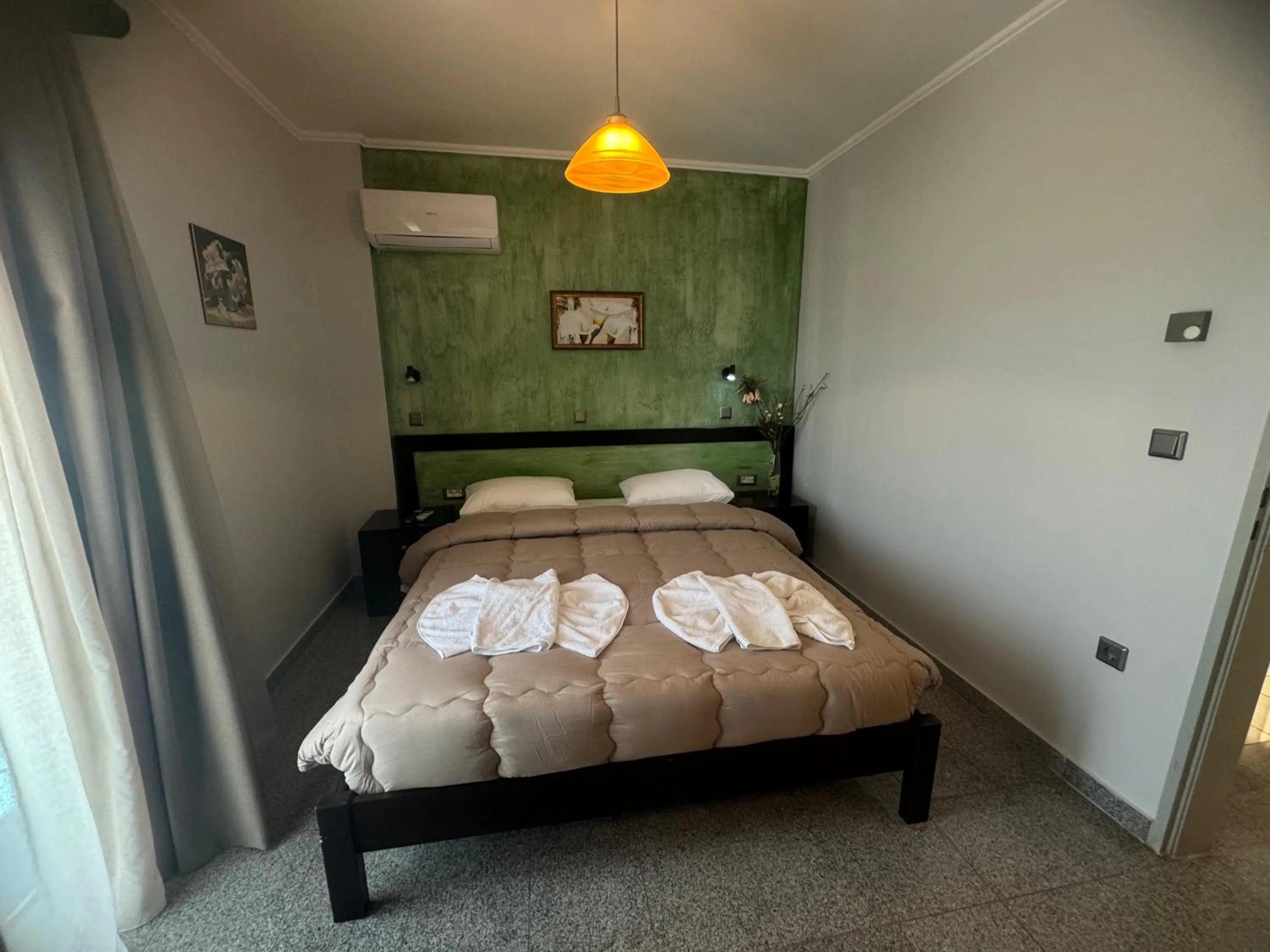 Bed in Comfort Hotel Apartments