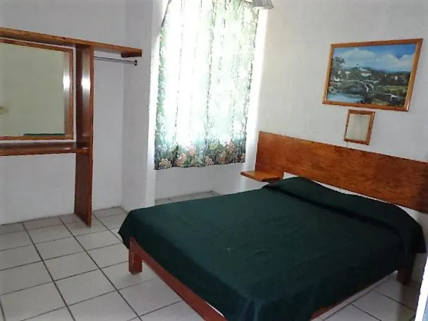 Bed in Hotel Vagabundo Puerto Vallarta