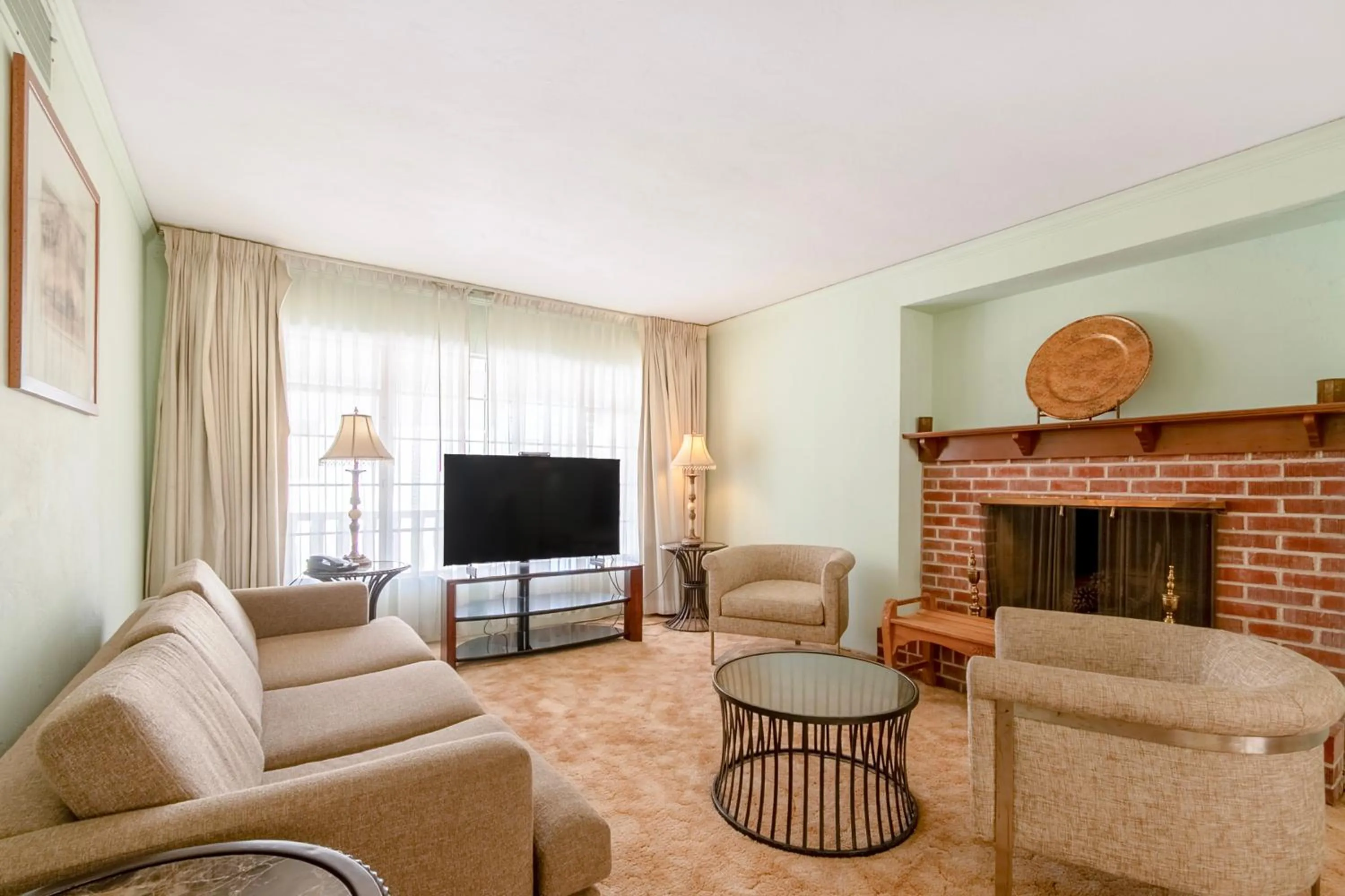 Seating area in Historic Coronado Motor Hotel by OYO