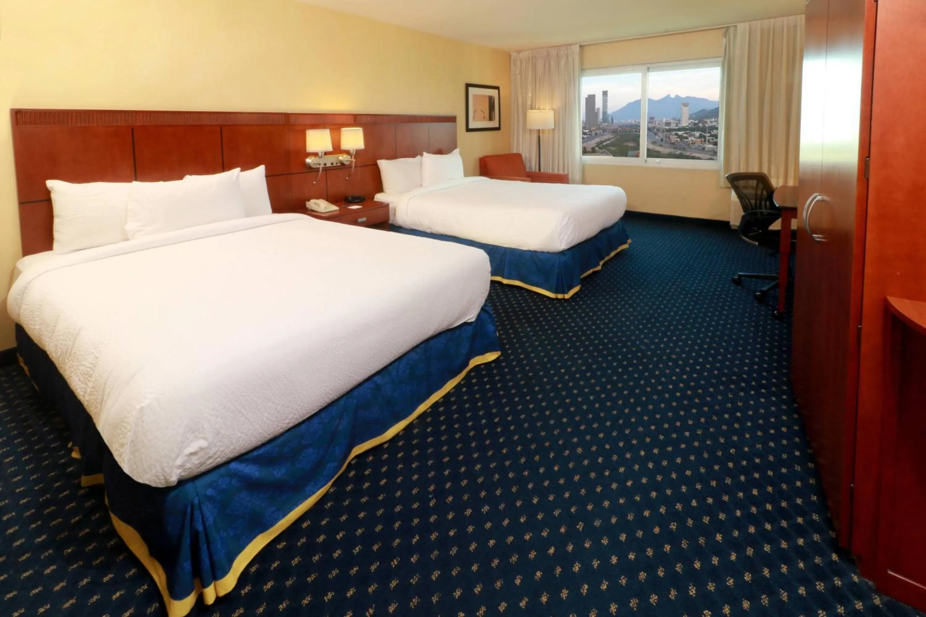 Photo of the whole room, Bed in Courtyard Monterrey San Jeronimo