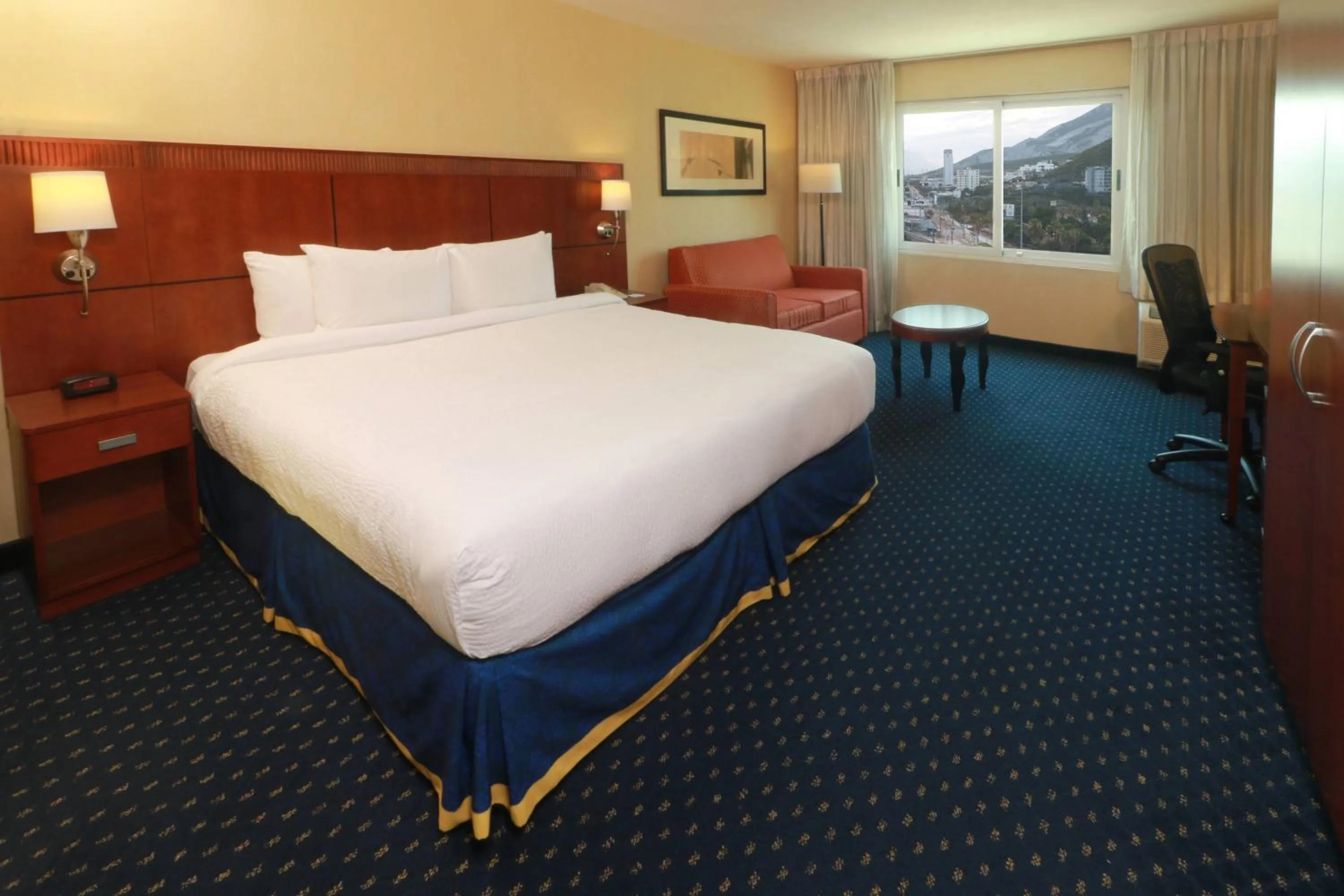 Photo of the whole room, Bed in Courtyard Monterrey San Jeronimo