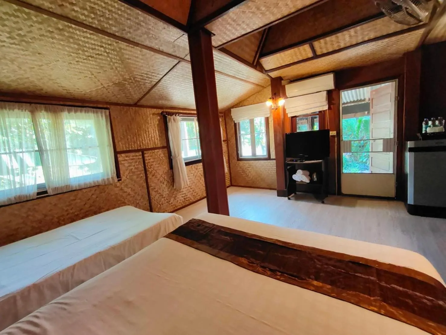 Bed in Baantawan Guesthouse Pai