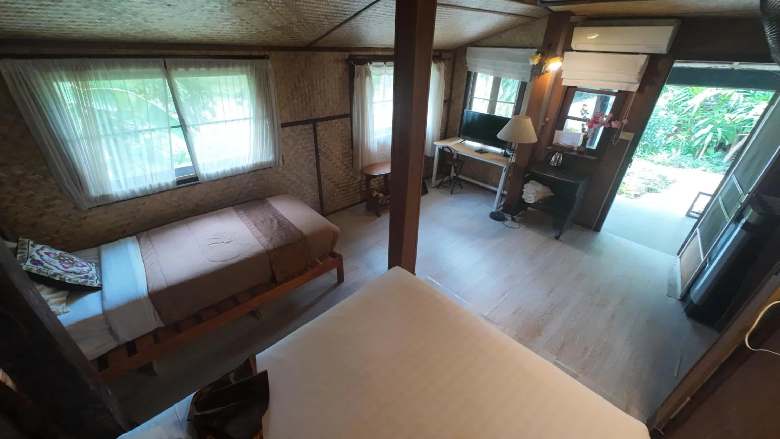 Bed in Baantawan Guesthouse Pai