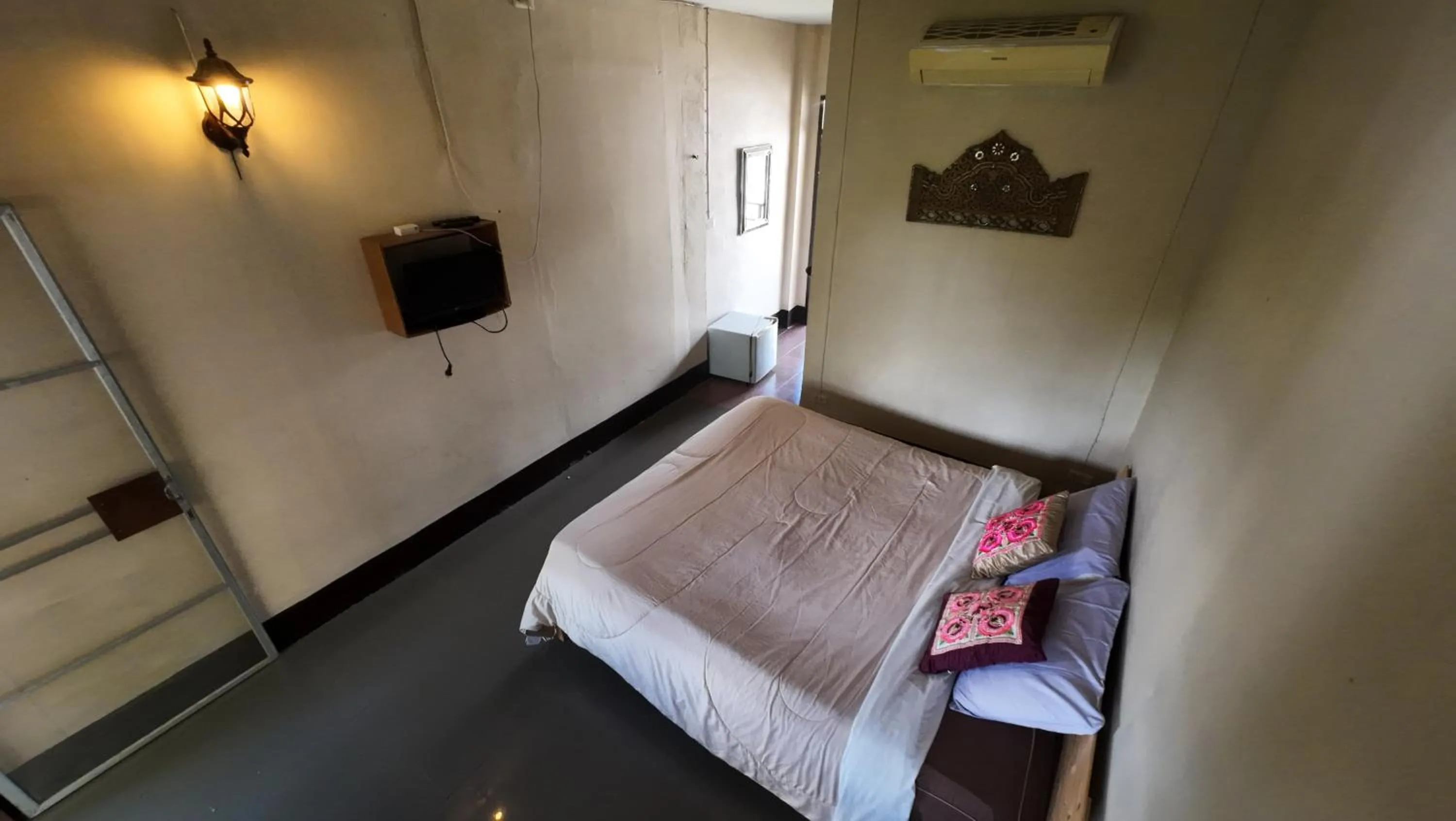 Bed in Baantawan Guesthouse Pai