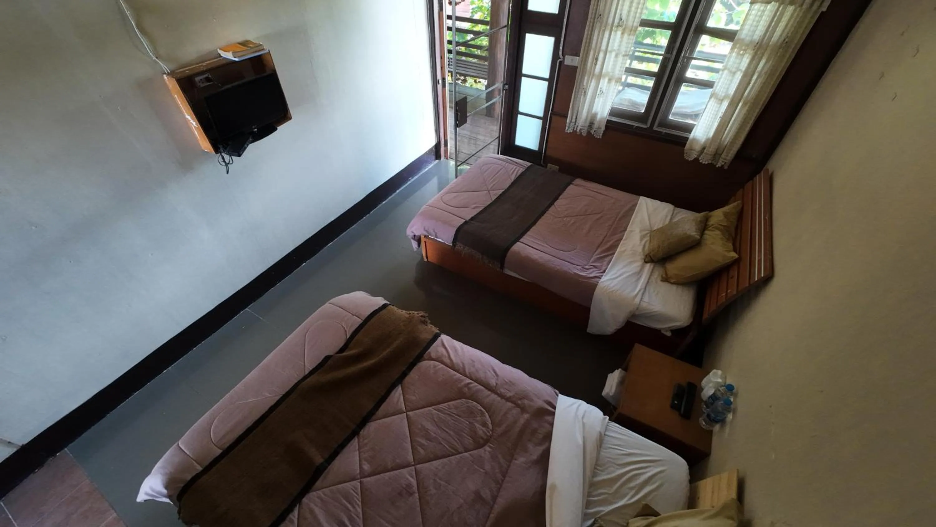 Bed in Baantawan Guesthouse Pai