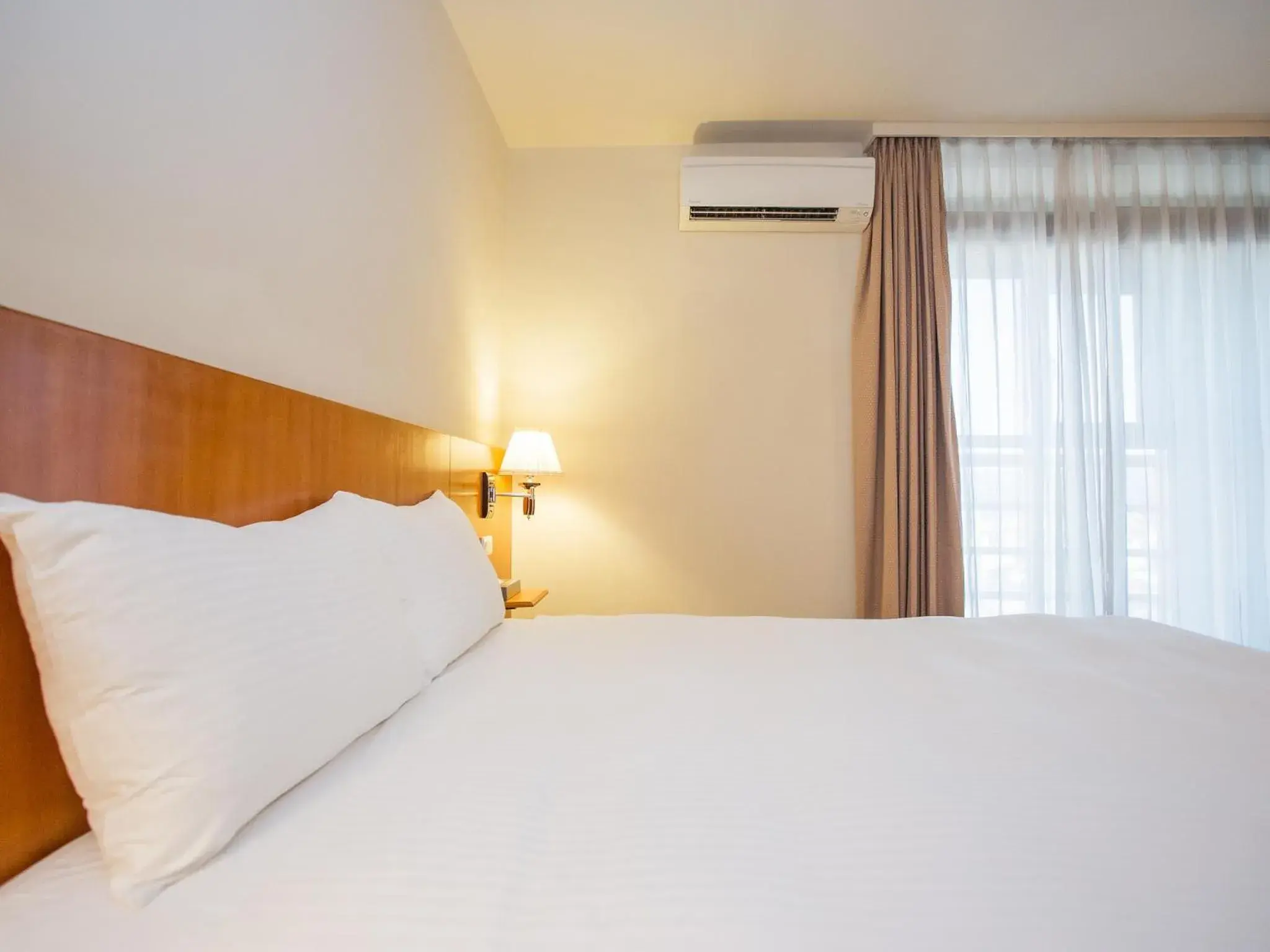 Bed in Jiuwu Hotel Bed in Jiuwu Hotel