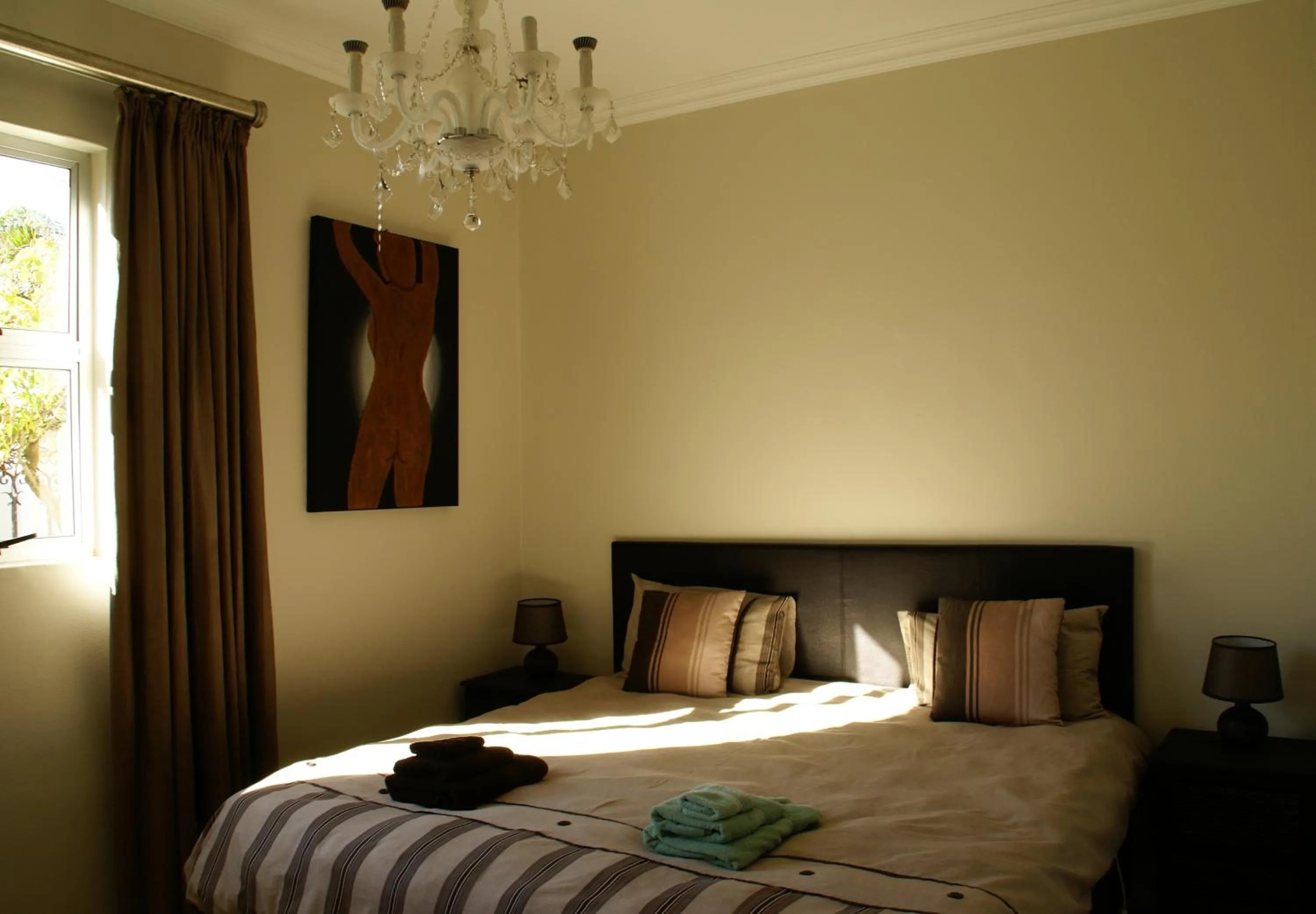 Bedroom in African Palm Cottage and Guesthouse