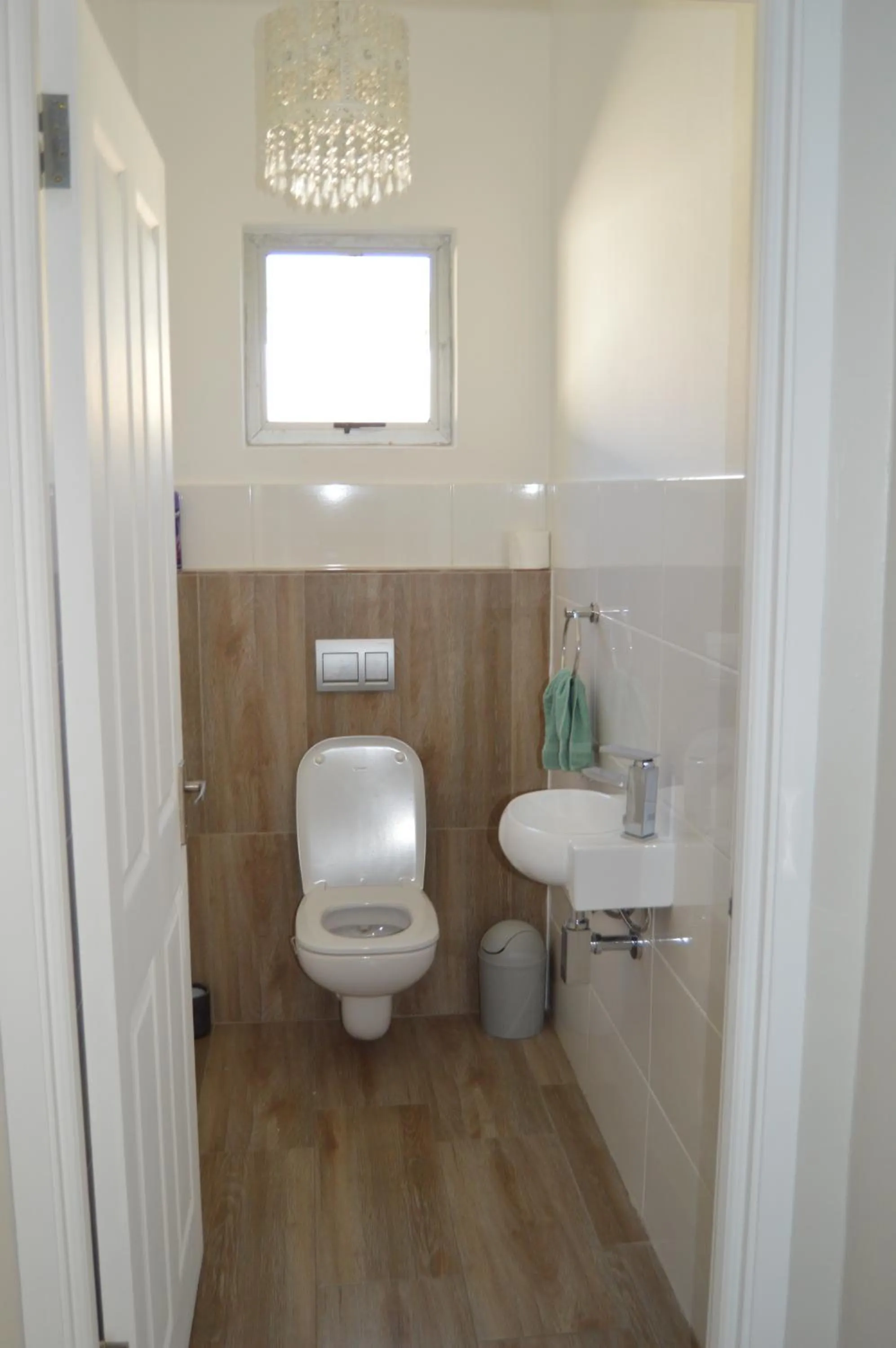 Toilet in African Palm Cottage and Guesthouse