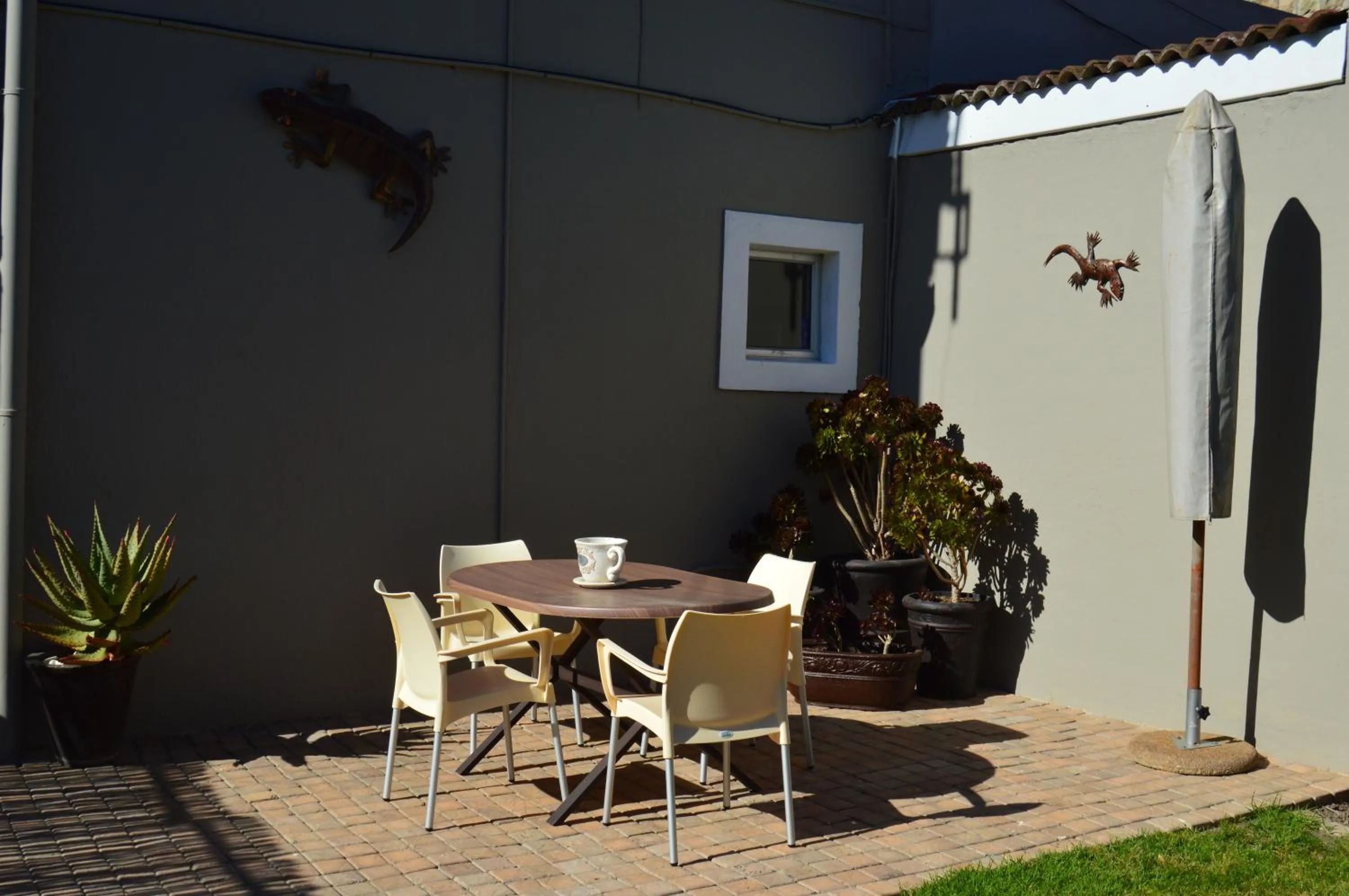 Balcony/Terrace in African Palm Cottage and Guesthouse