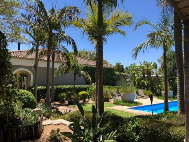 Swimming pool in African Palm Cottage and Guesthouse