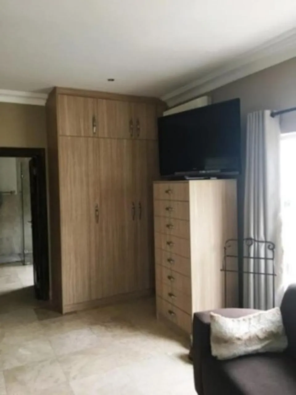 Bedroom in African Palm Cottage and Guesthouse