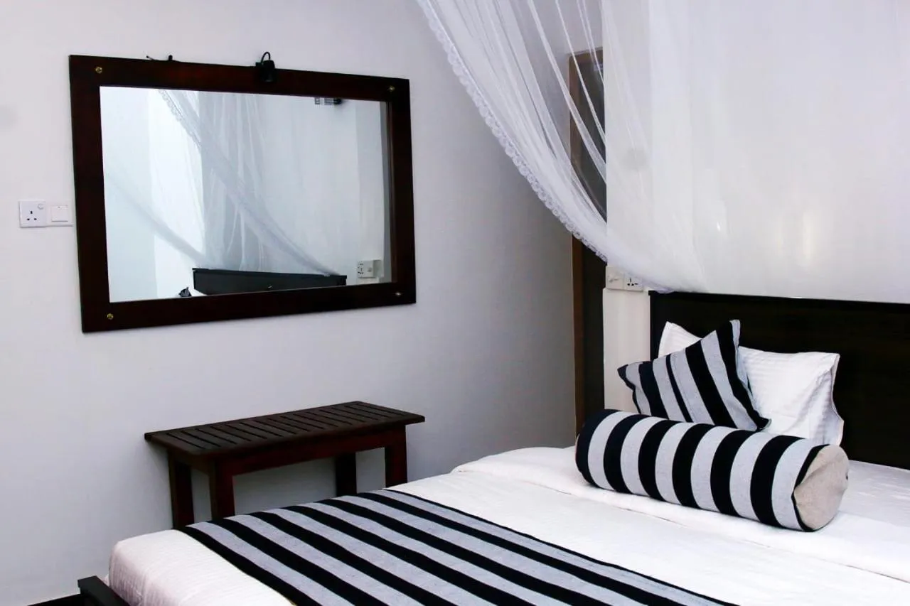 Photo of the whole room, Bed in Different View