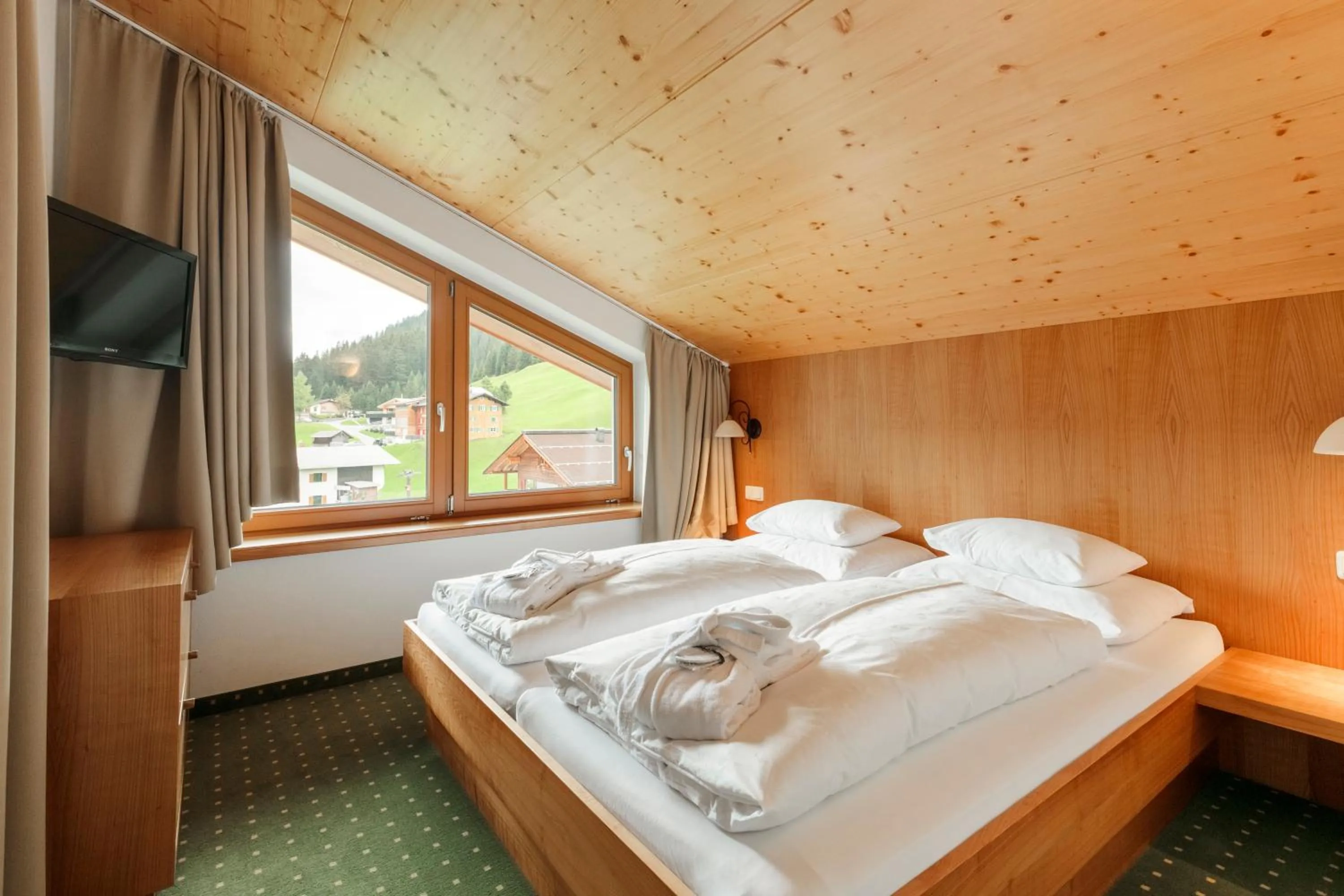 Bedroom, Bed in Hotel Schranz - Ski In & Ski Out