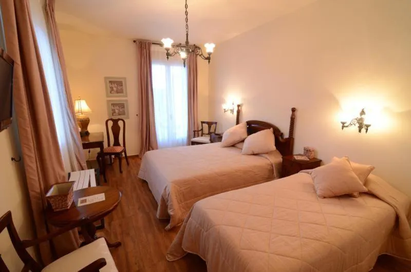 Bed in Korina Gallery Hotel