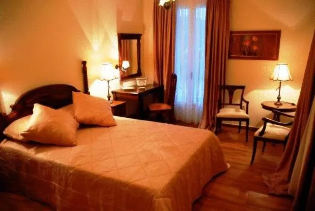 Bed in Korina Gallery Hotel