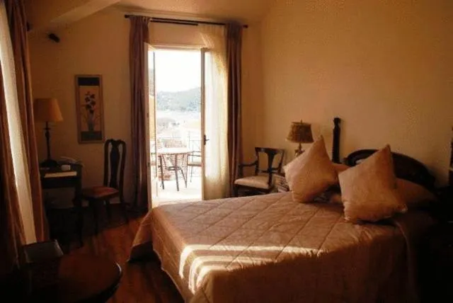 Bed in Korina Gallery Hotel