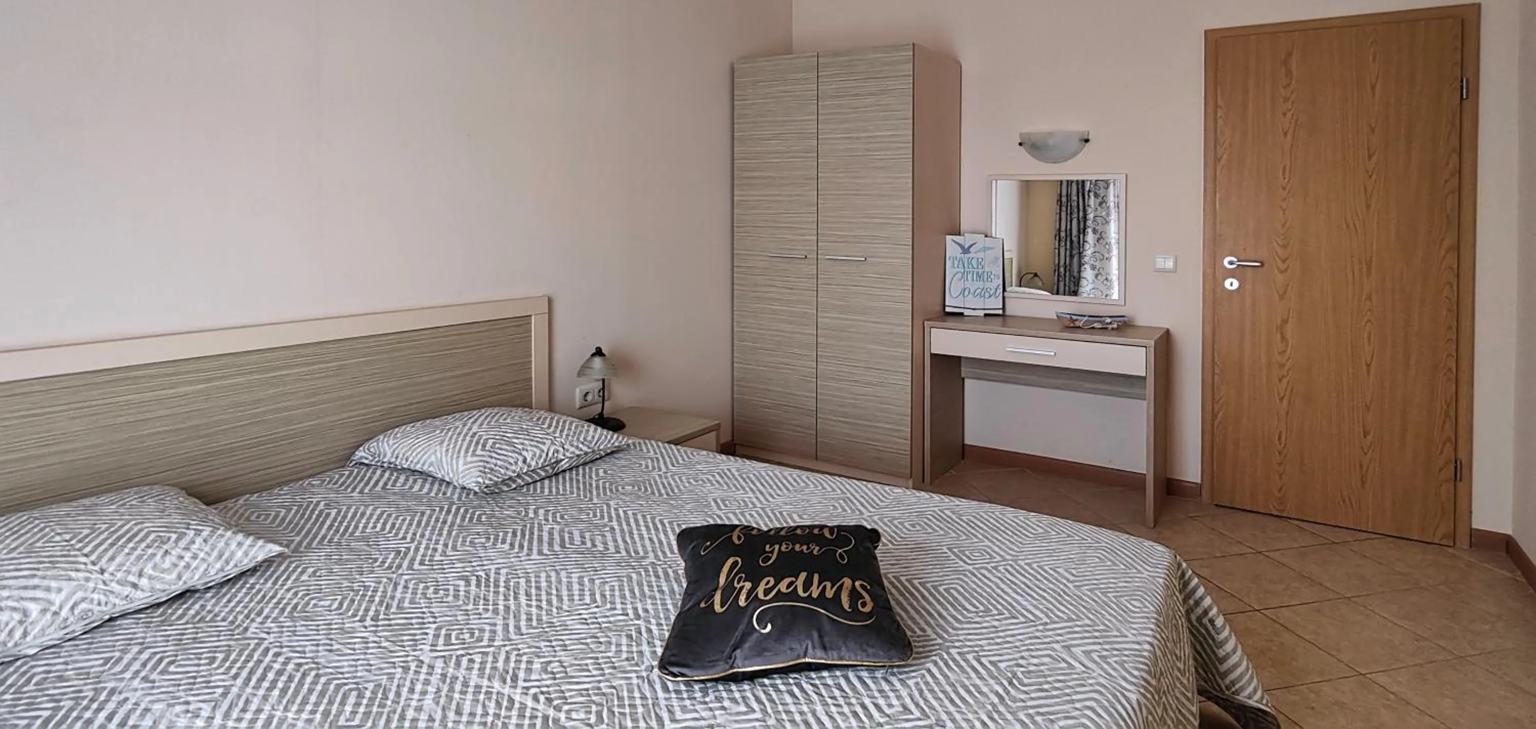 Bed in Royal Sun Apartments