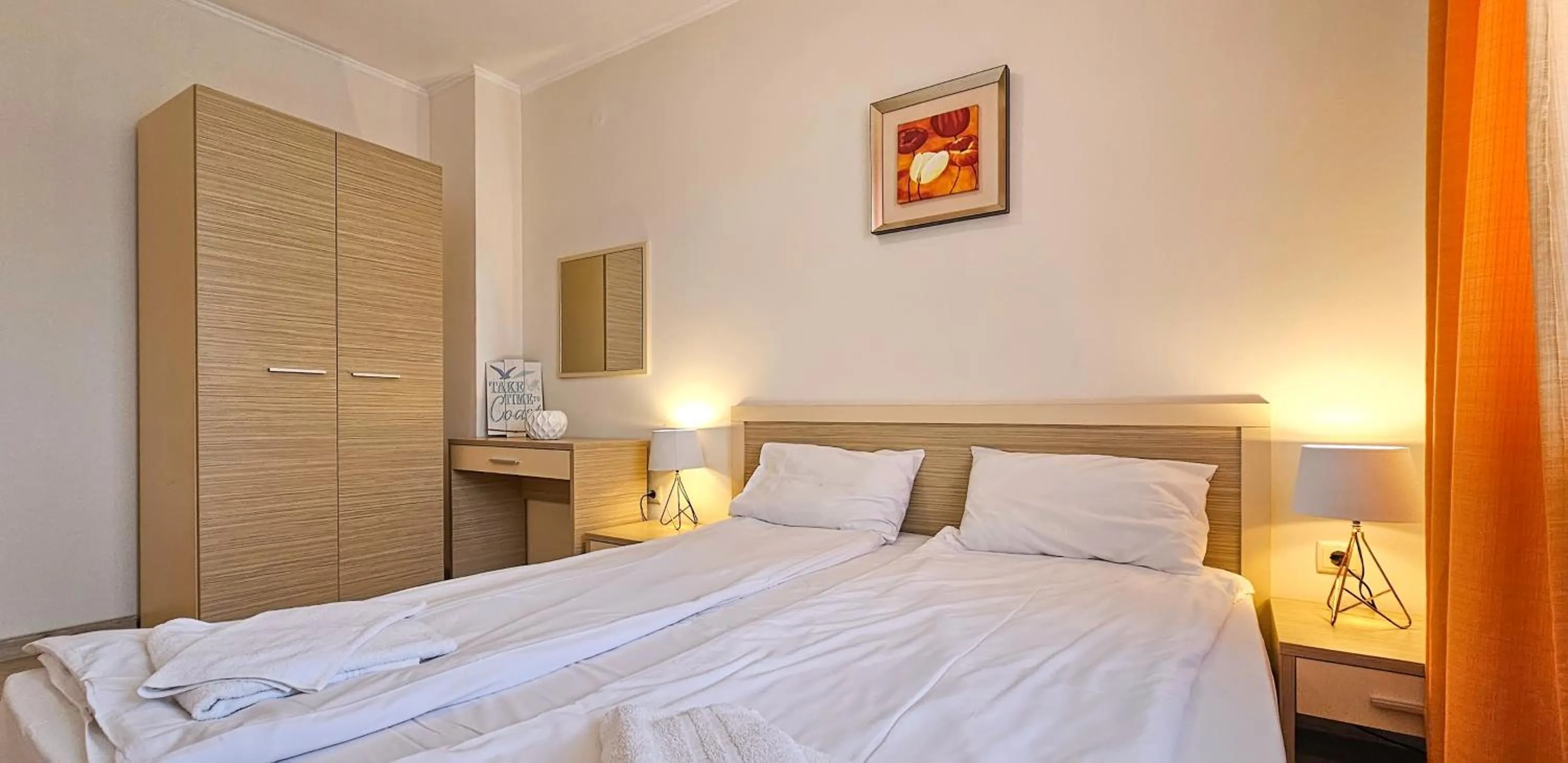 Bed in Royal Sun Apartments