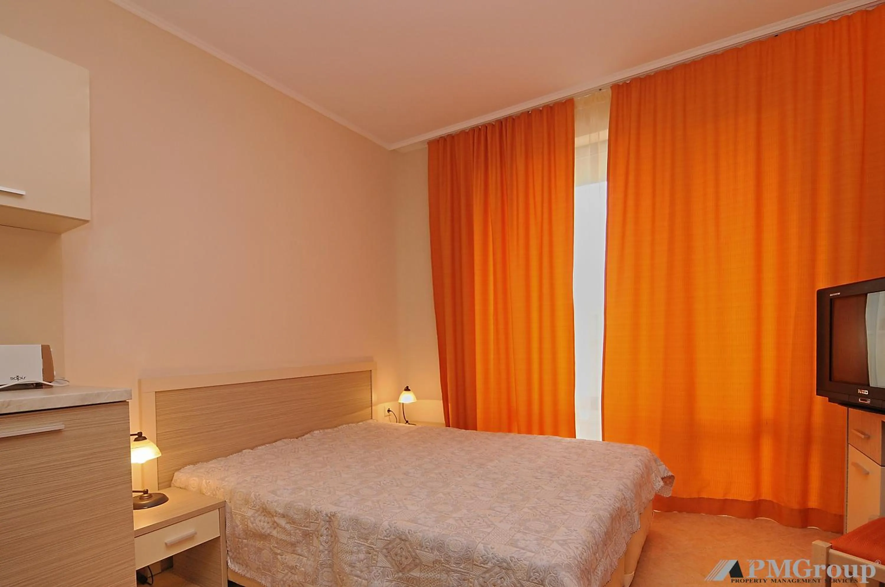 Bed in Royal Sun Apartments