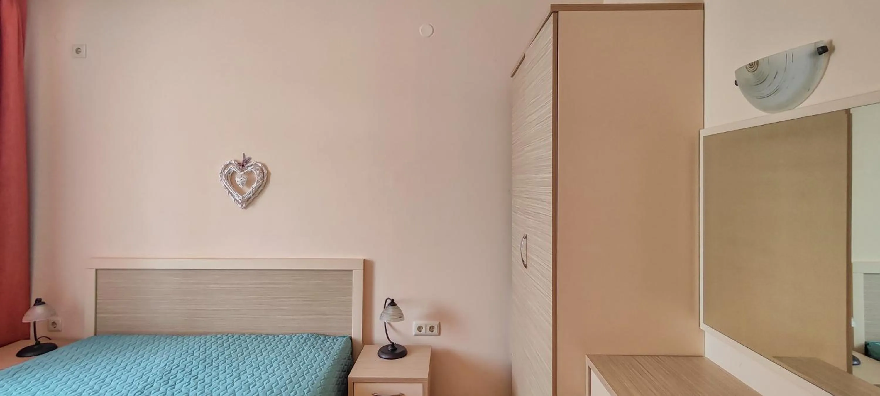 Bed in Royal Sun Apartments