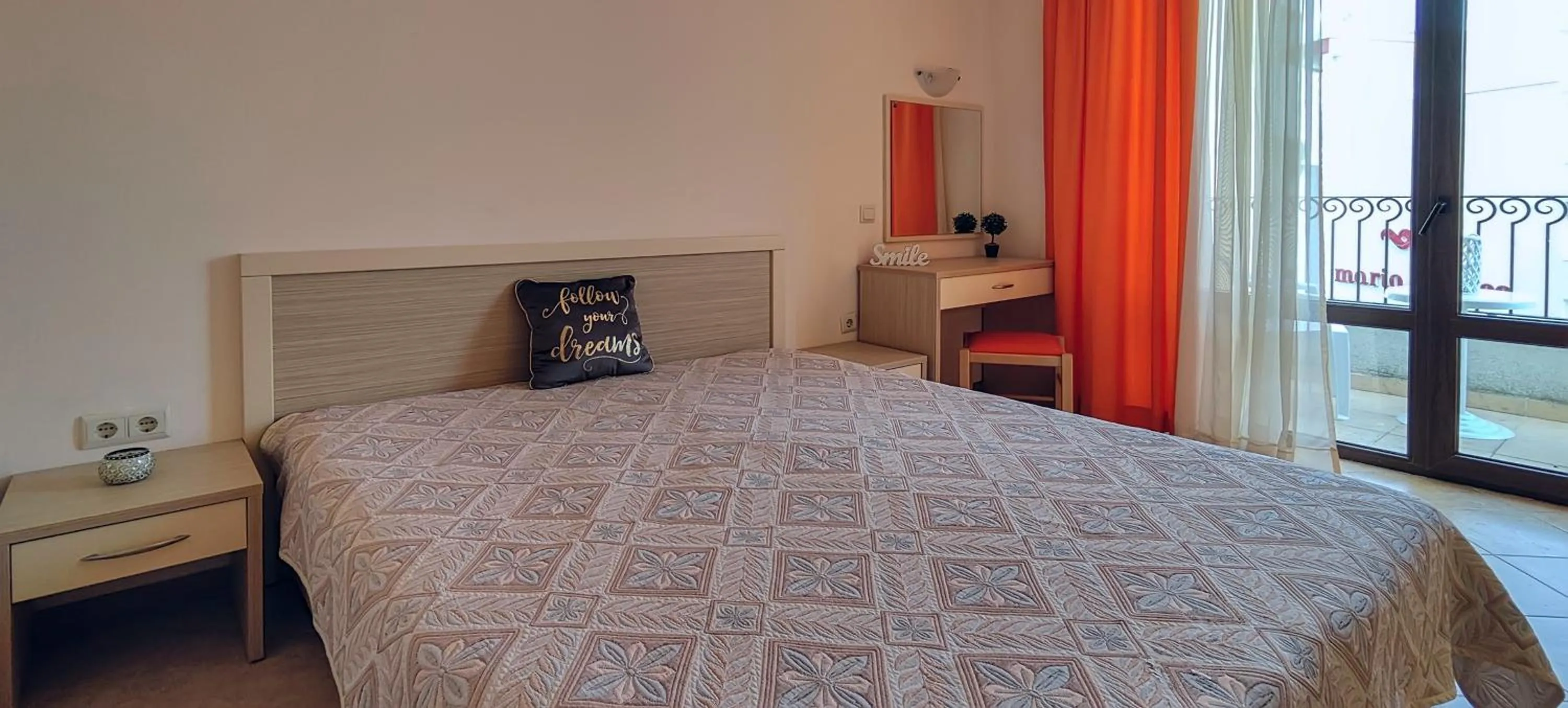 Bed in Royal Sun Apartments