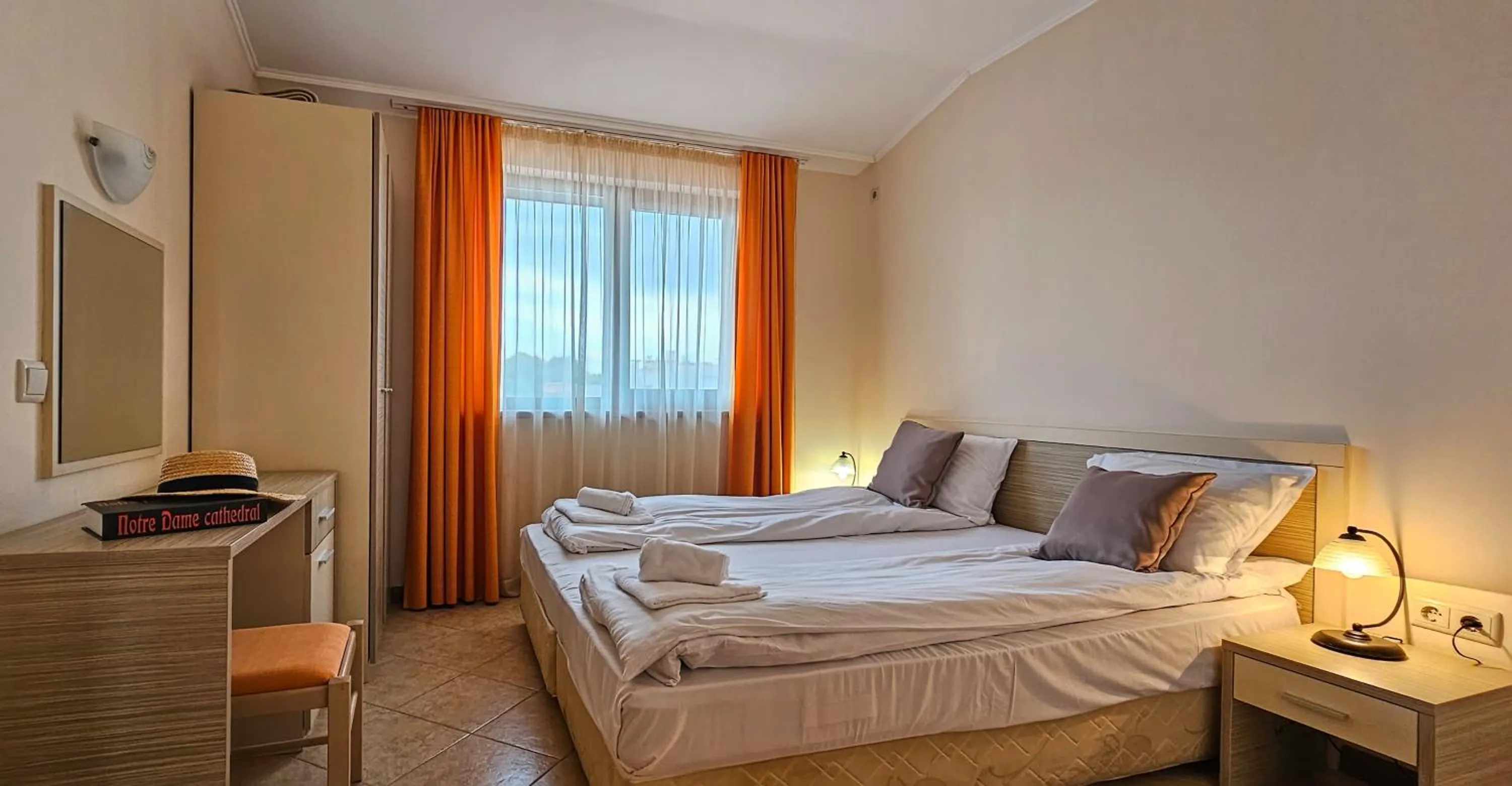 Bed in Royal Sun Apartments