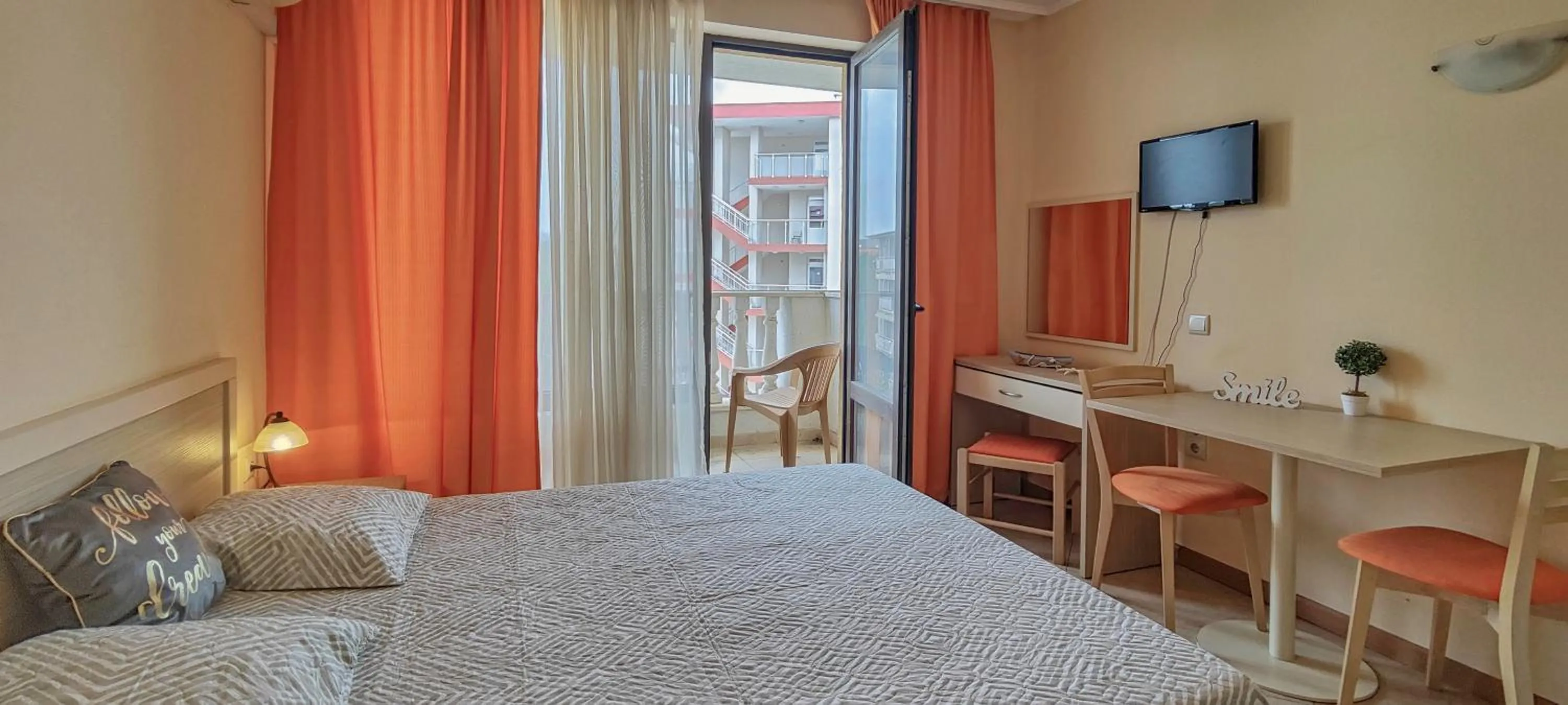 Bed in Royal Sun Apartments