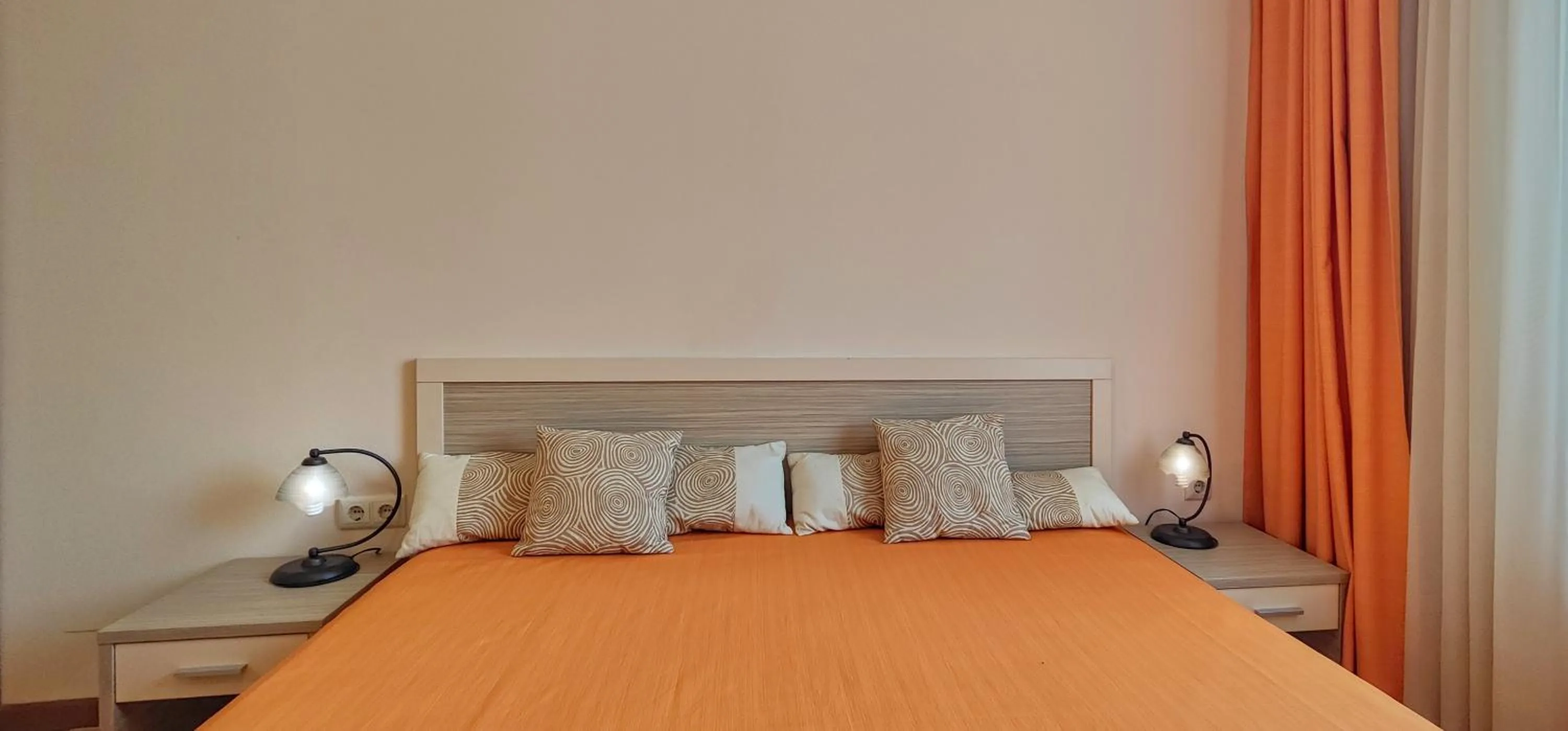 Bed in Royal Sun Apartments