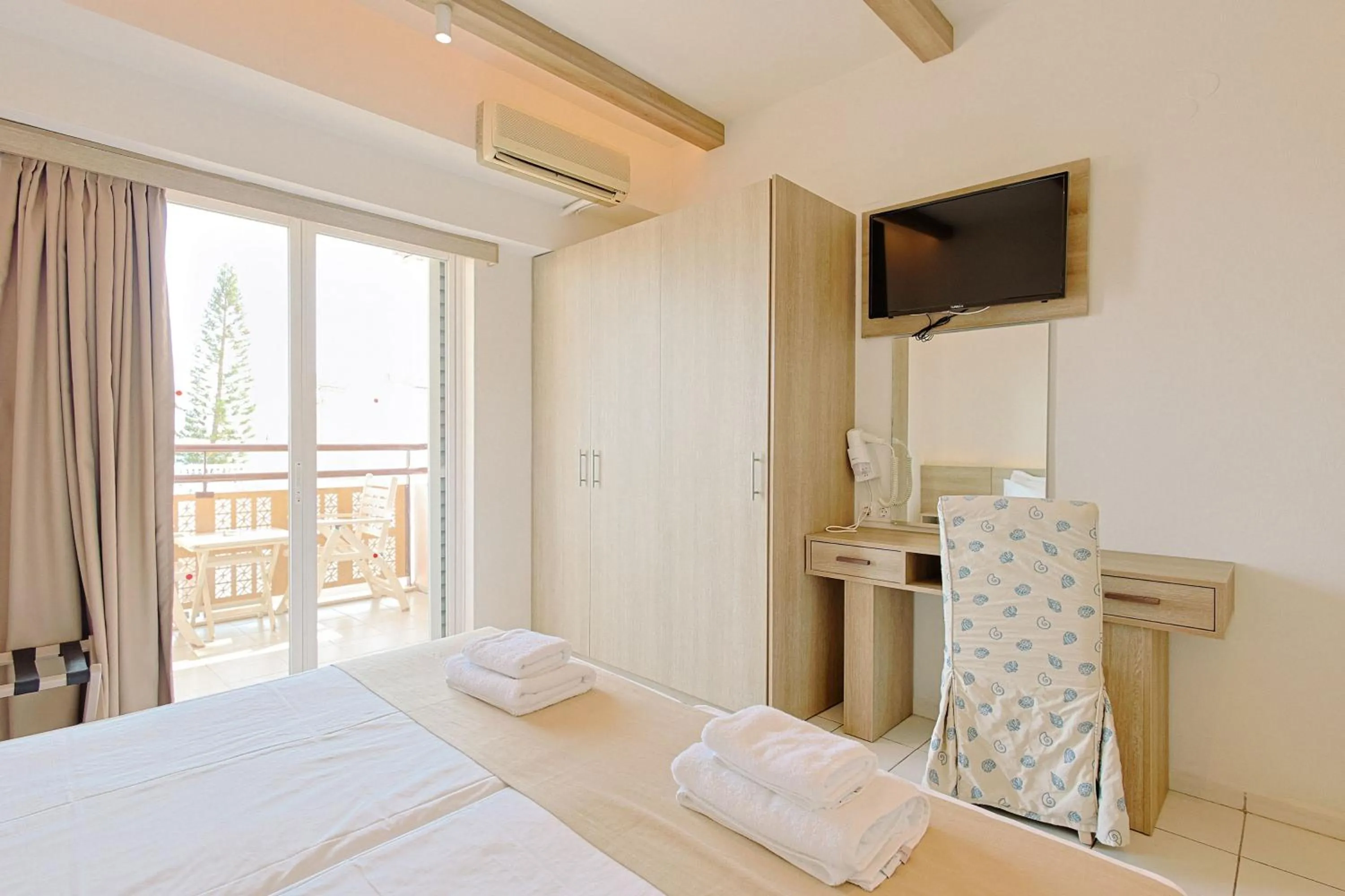 Bed in Porto Greco Village Beach Hotel