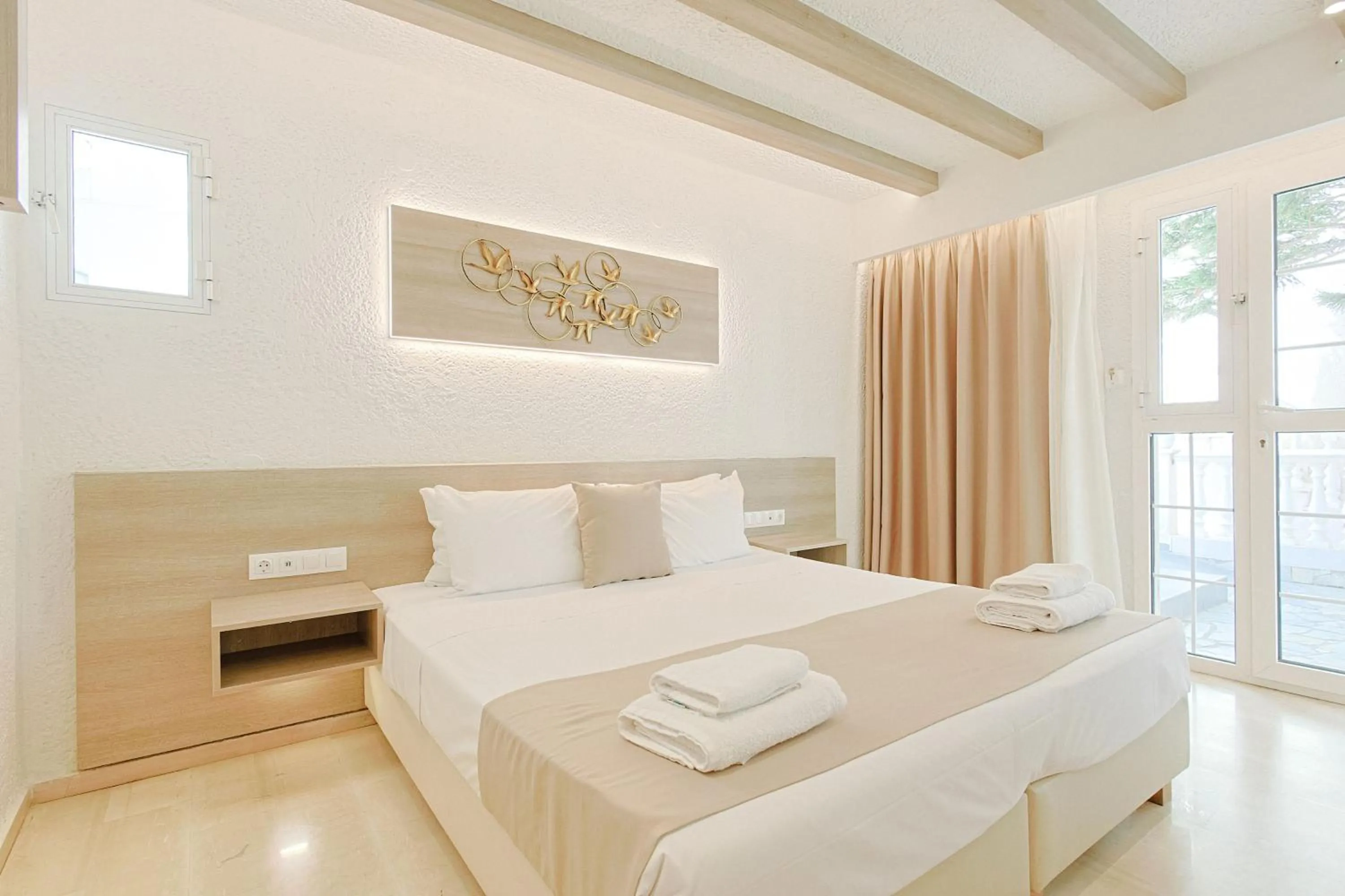 Bed in Porto Greco Village Beach Hotel