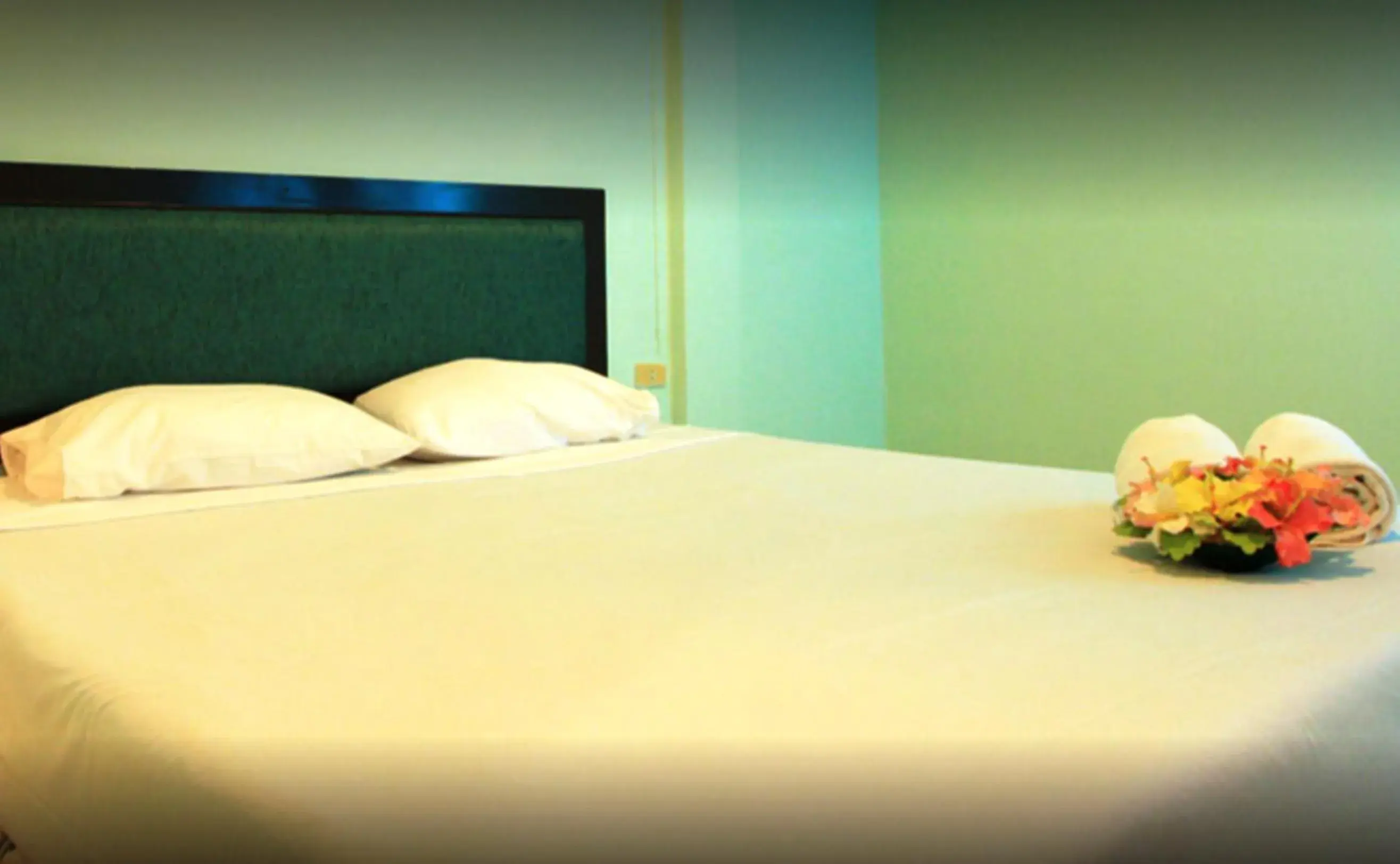 Bed in Chaba Chalet Hotel Bed in Chaba Chalet Hotel