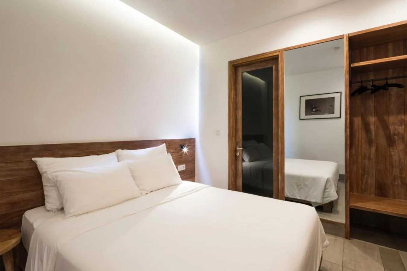 Bed in Triple E Hotel Fine Art Museum