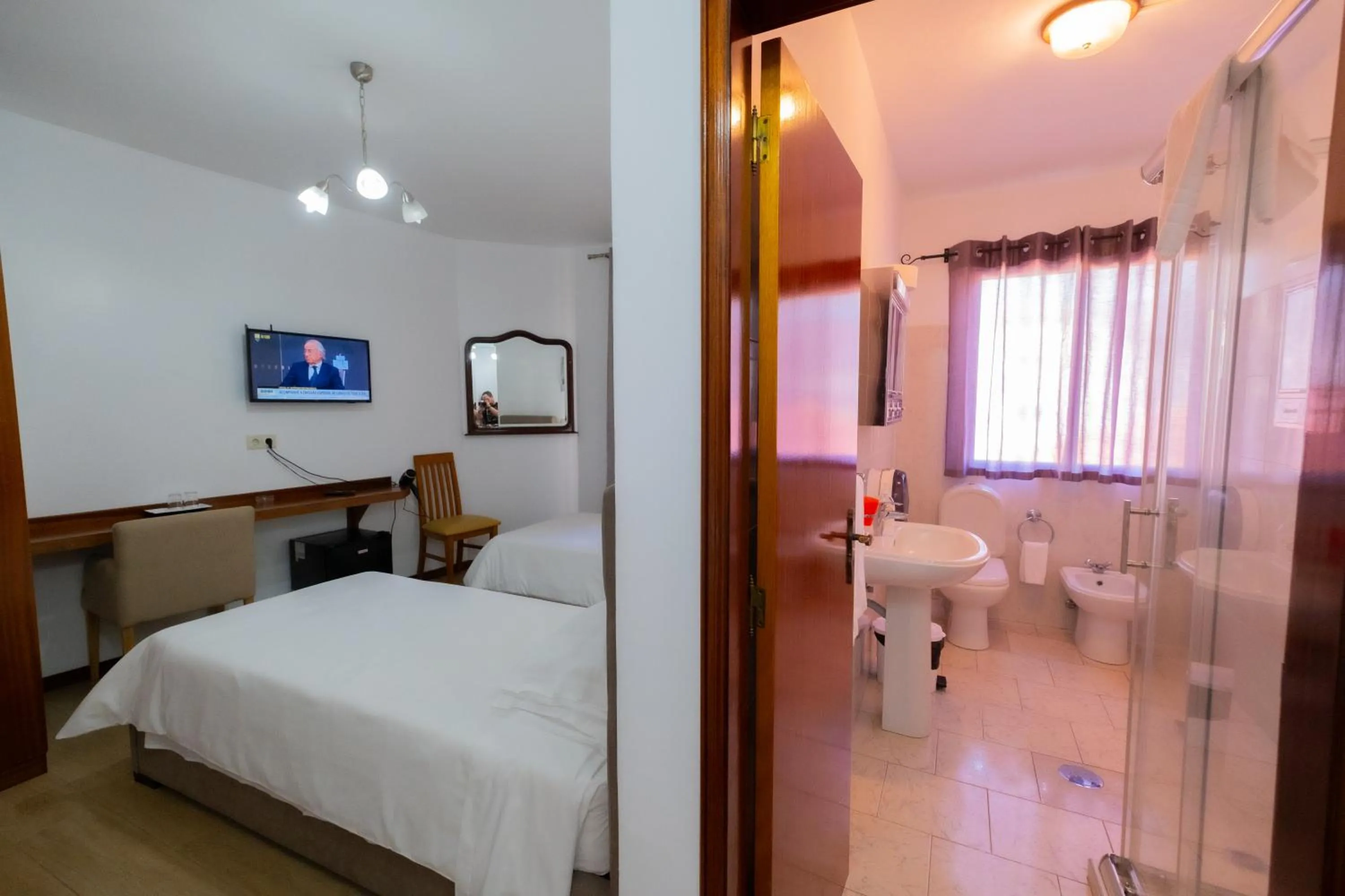 Toilet, Bed in Residencial Familia