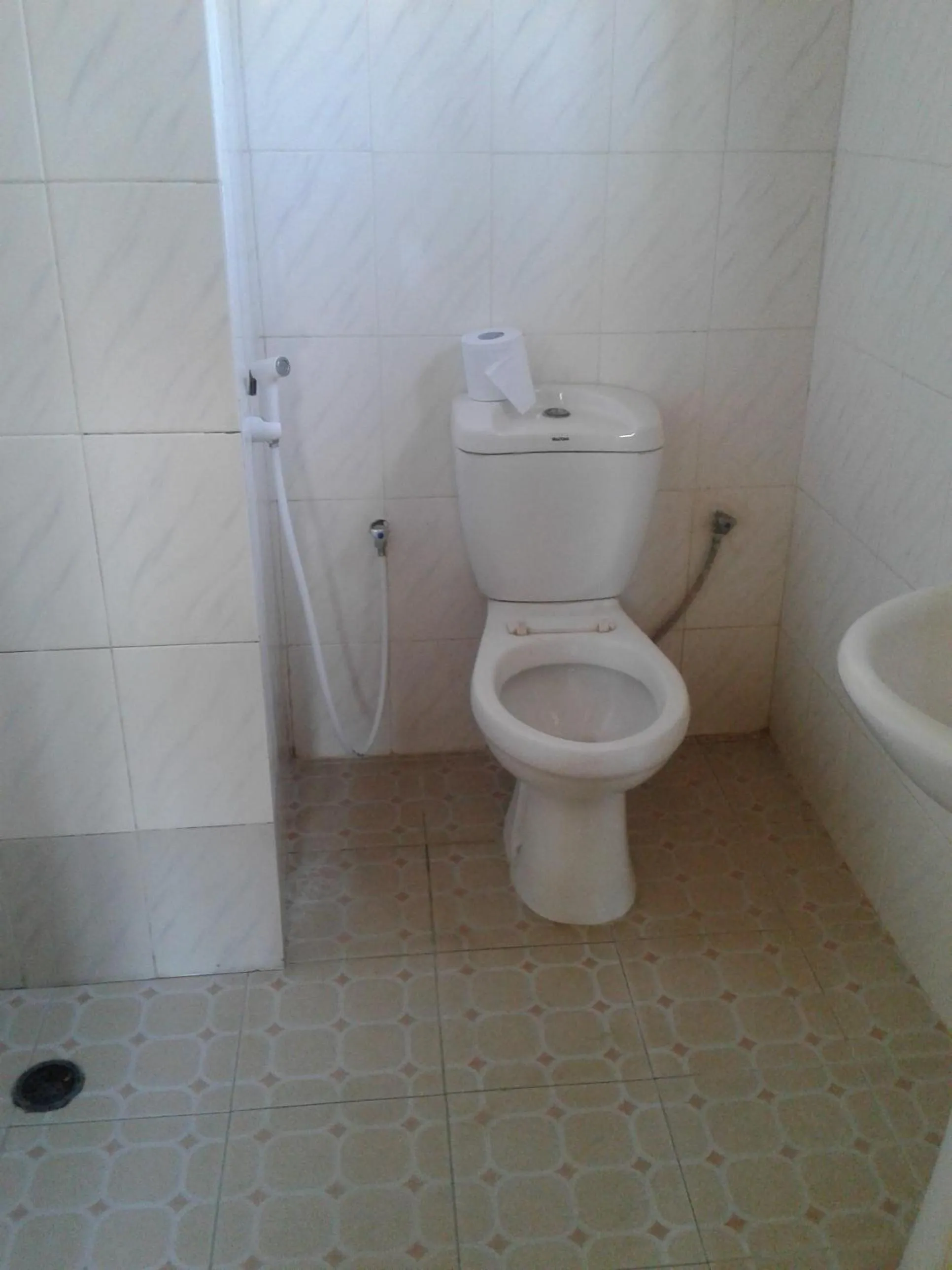 Toilet in JJ & JE Family House