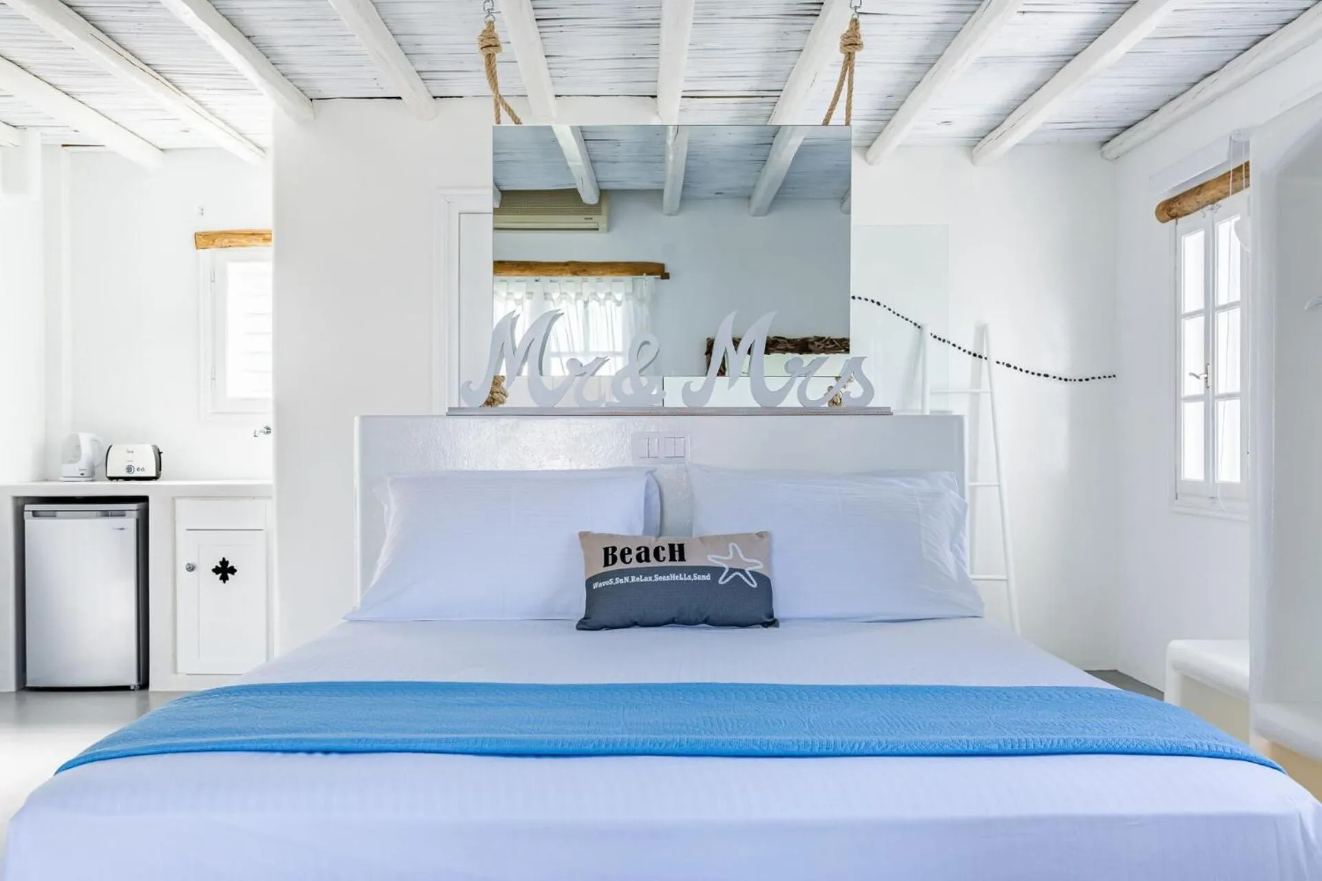 Bed in Evlalia Studios & Villas