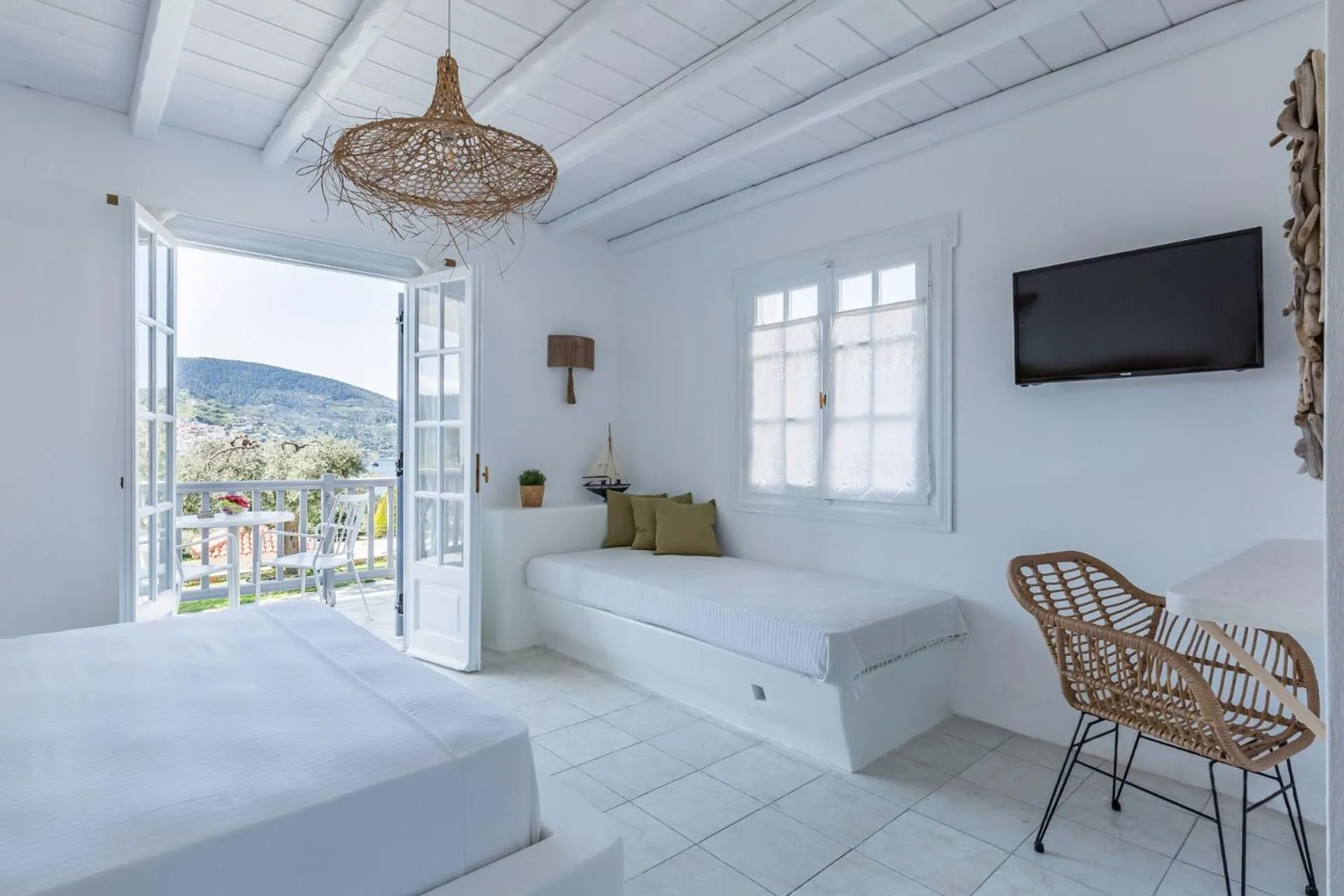 Bed in Evlalia Studios & Villas