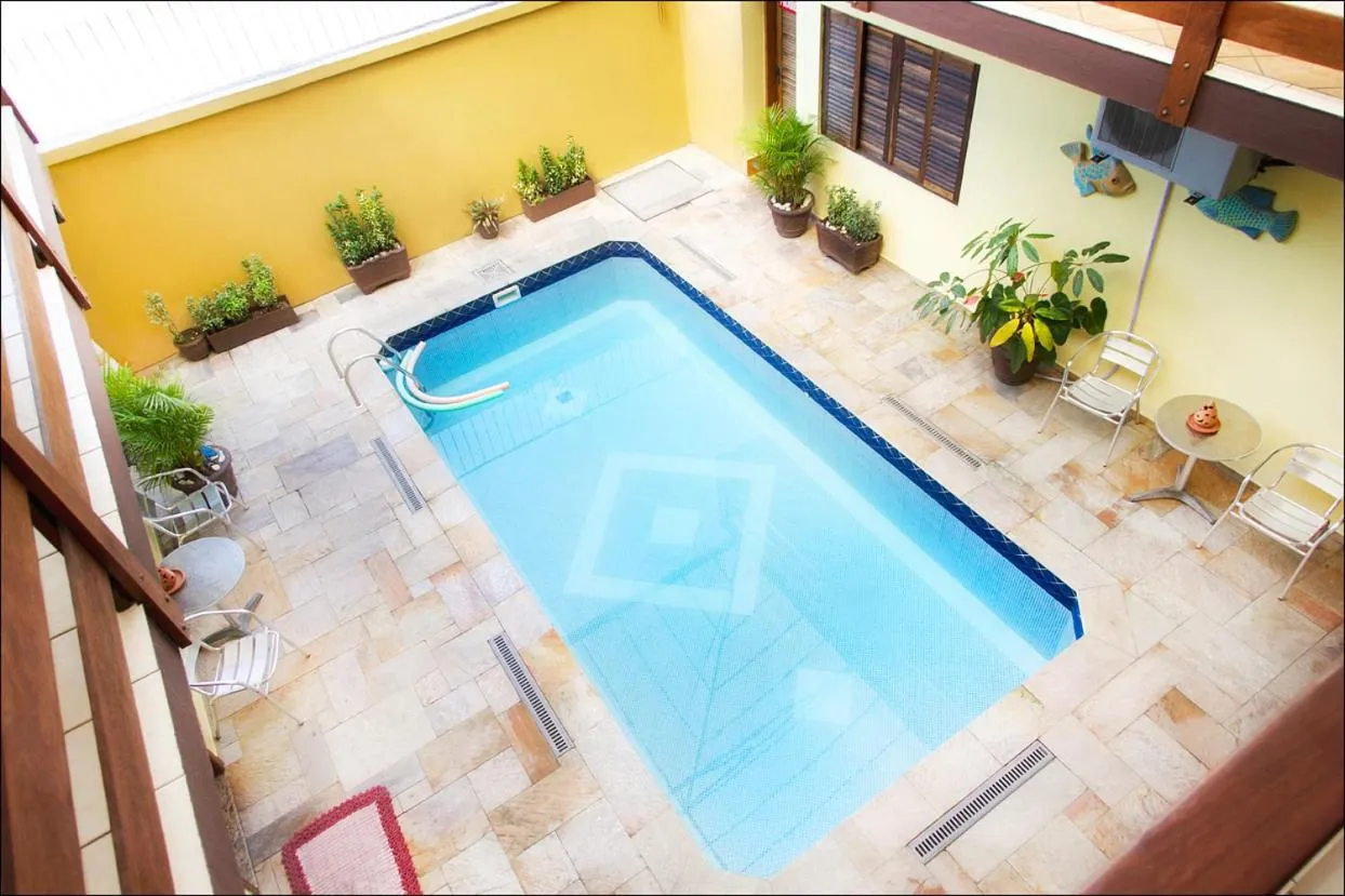 Swimming pool in Pousada Solarium UNIDADE 1 ECONOMICA-BÁSICA
