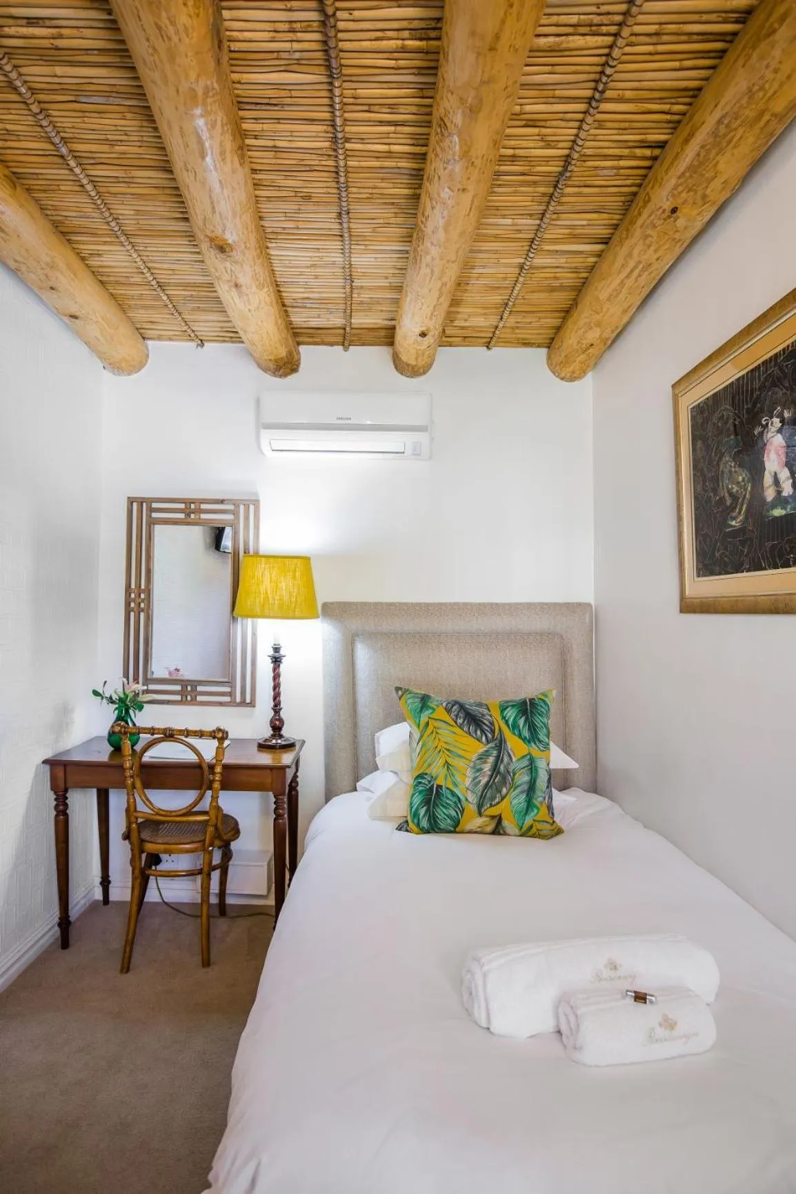 Bed in Roosenwijn Guesthouse