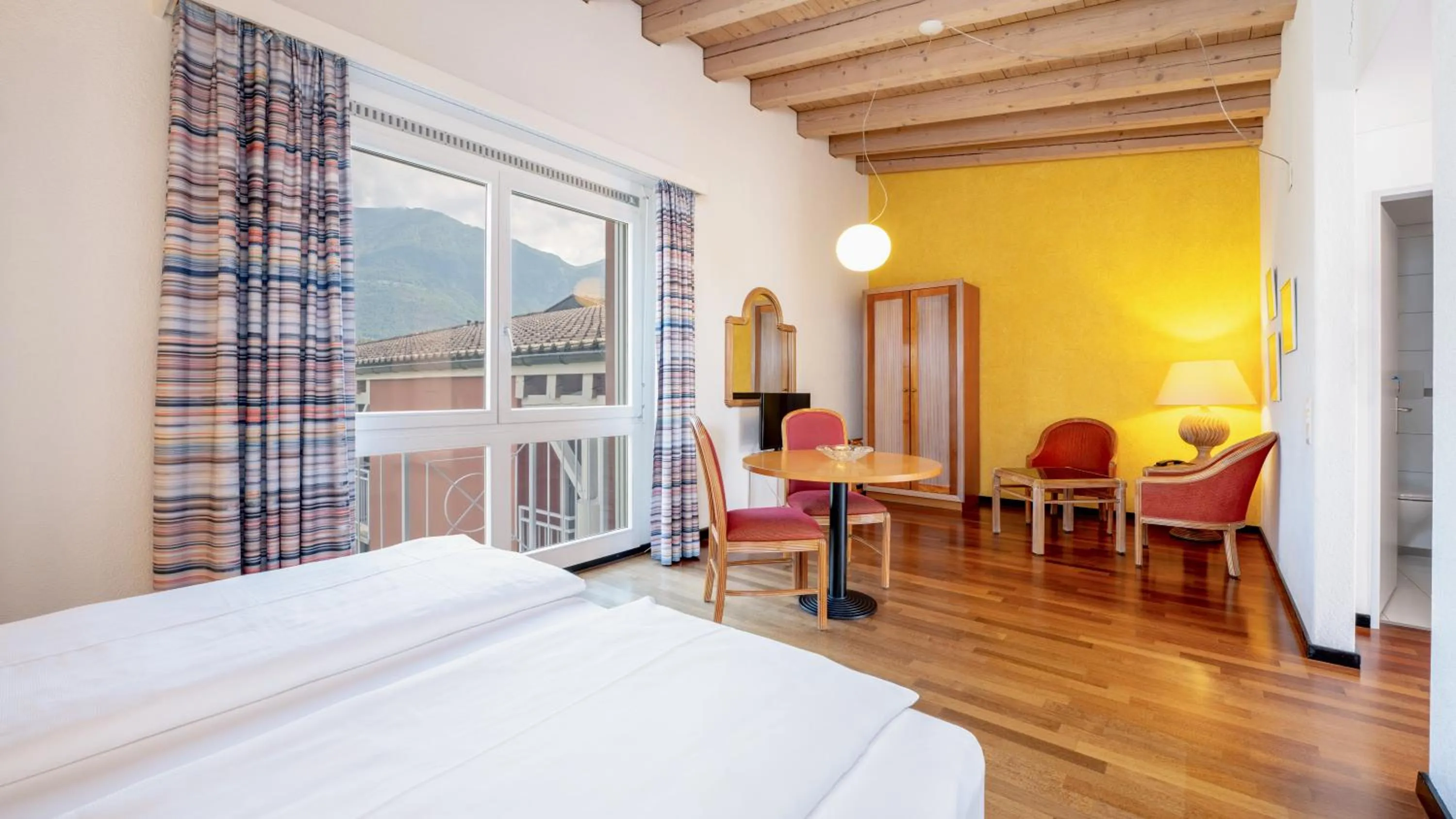 Living room, Bed in Hapimag Resort Ascona