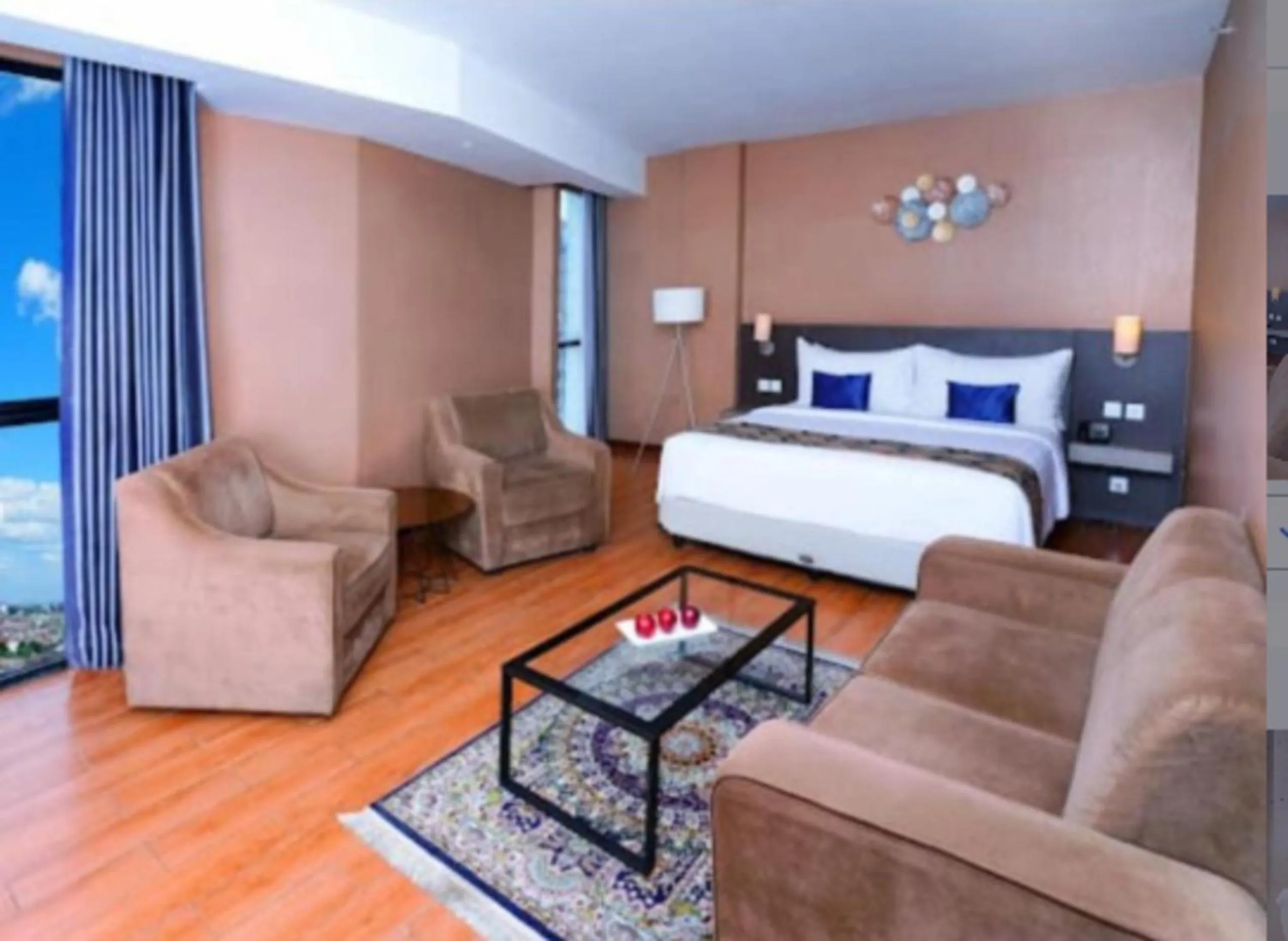 Seating area, Bed in Aston Inn Pandanaran